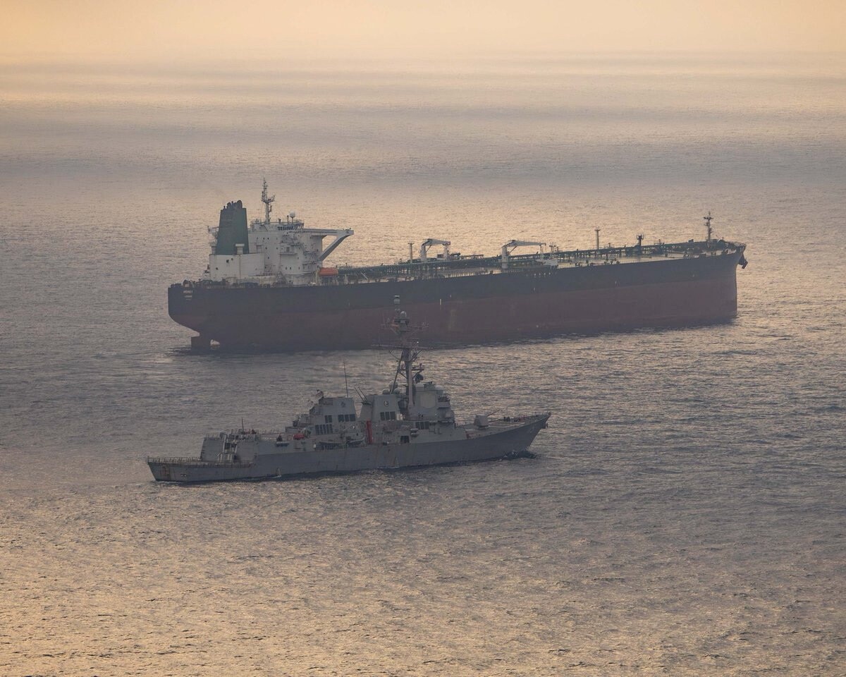 USS Rafael Peralta (DDG 115) near what the U.S. Central Command said was a vessel attempting to sail to an Iranian port, as it enforces the U.S. blockade on Iranian ports, at an unknown location, released April 24, 2026.   U.S. Central Command/Handout via REUTERS    THIS IMAGE HAS BEEN SUPPLIED BY A THIRD PARTY. MANDATORY CREDIT.  Verification Lines:  Reuters was able to identify Guided-missile destroyer USS Rafael Peralta (DDG 115) from the deck layout, mast, and superstructure of the vessel that matched file images Location and date could not be verified No earlier versions of the image were found posted online before April 24