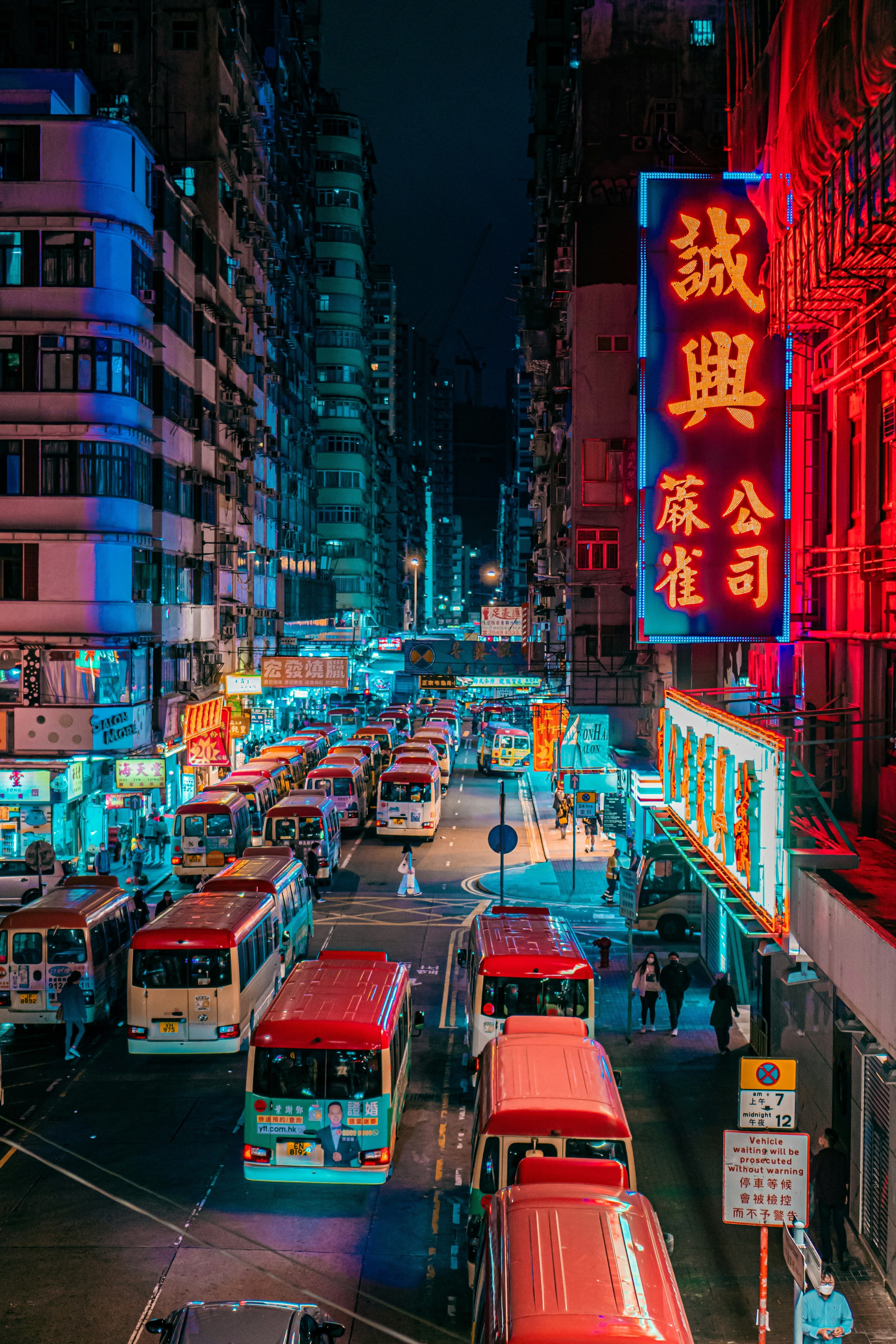 Red bus on road during the night in Hong Kong: Asia could lead on climate and nature solutions with catalytic capital