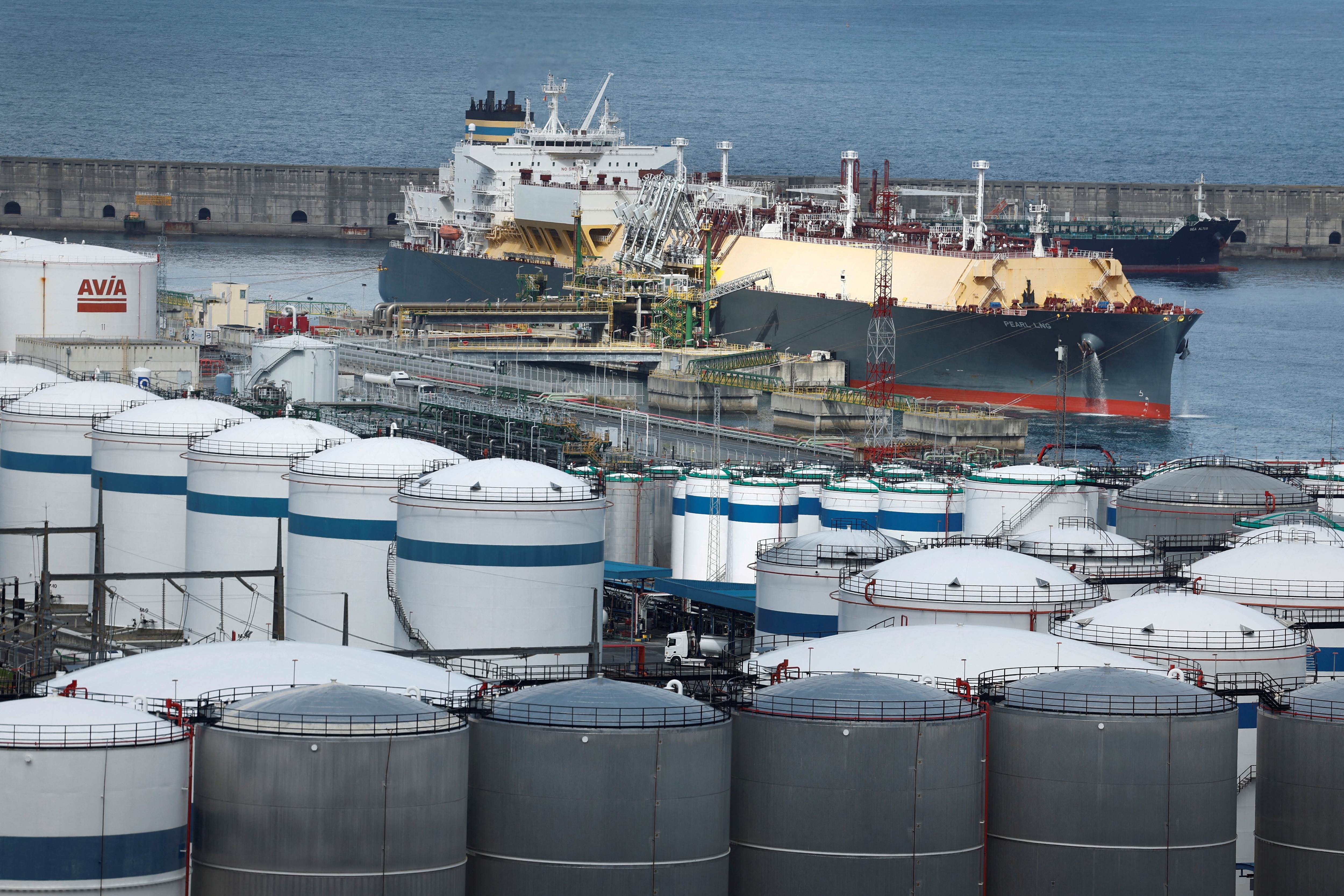 Maltese flagged liquid natural gas tanker Pearl LNG sits alongside gas storage facilities, following arrival from the US port of Ingleside, at Bilbao port, northern Spain.