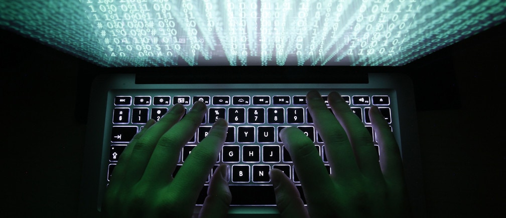 A man types on a computer keyboard in Warsaw in this February 28, 2013 illustration file picture. One of the largest ever cyber attacks is slowing global internet services after an organisation blocking "spam" content became a target, with some experts saying the disruption could get worse.        To match INTERNET-ATTACK/      REUTERS/Kacper Pempel/Files (POLAND - Tags: BUSINESS SCIENCE TECHNOLOGY) - GM1E93S08G701