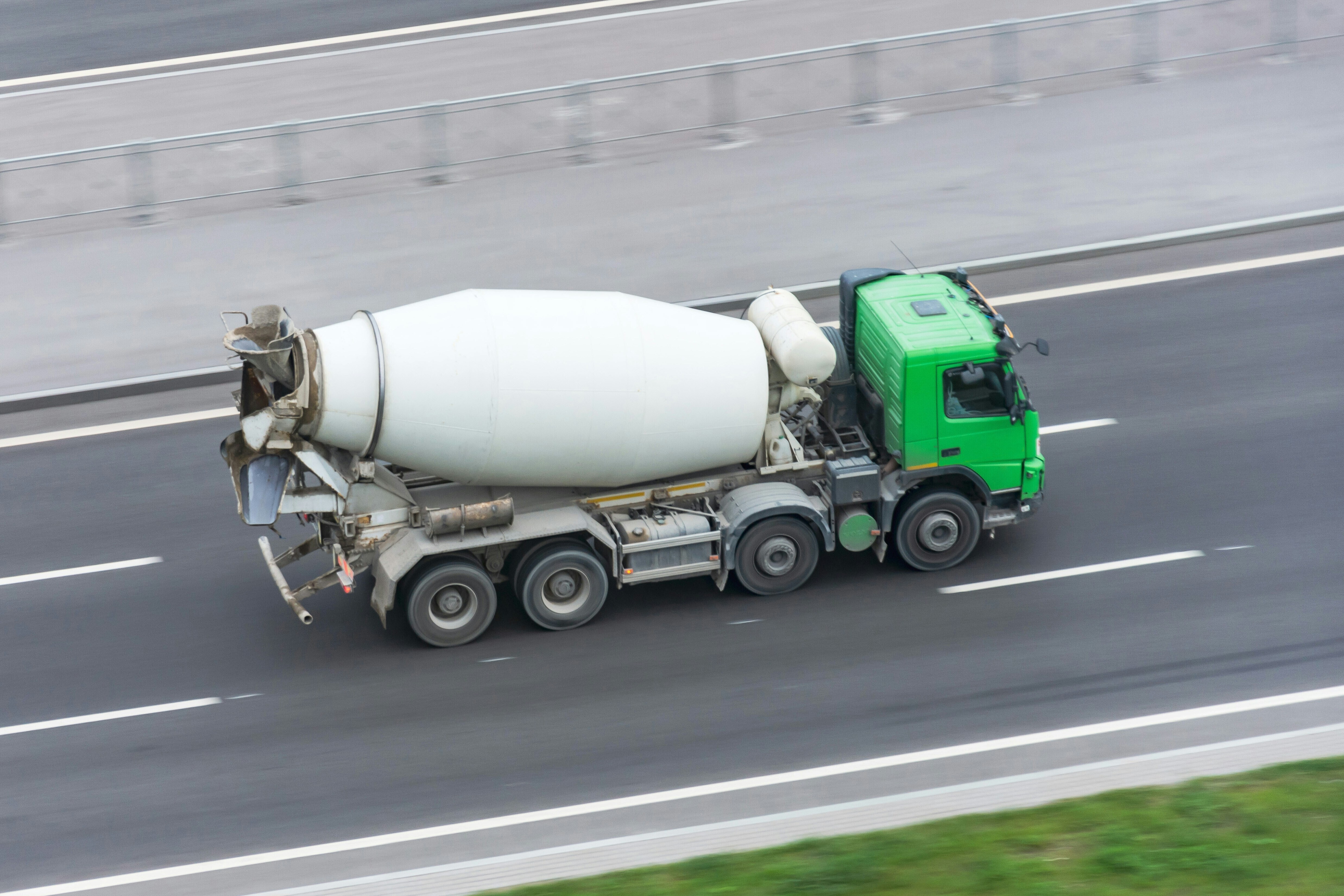 Cement mixer on the road, cement and concrete and in huge demand