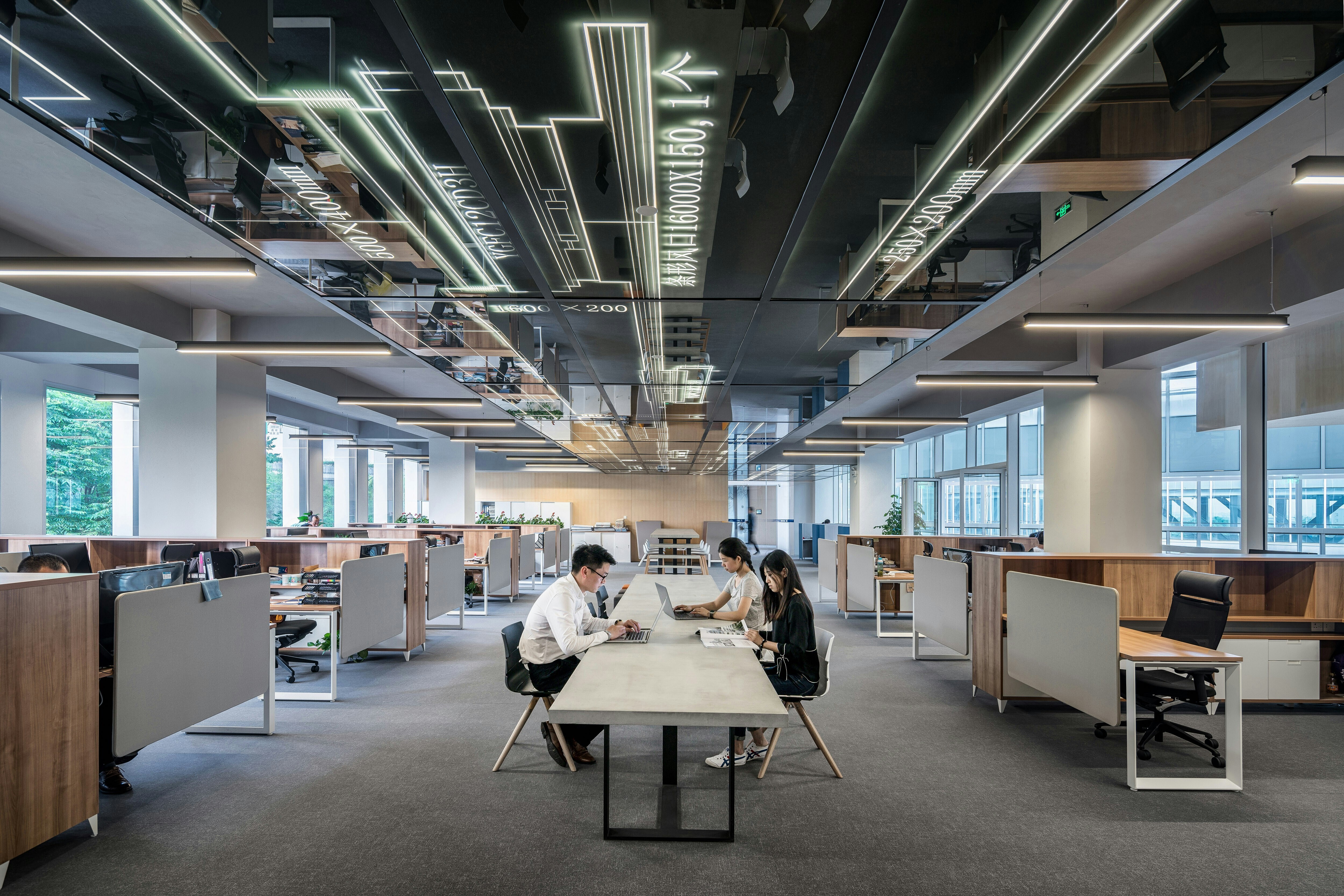 Young workers sat in an empty office
