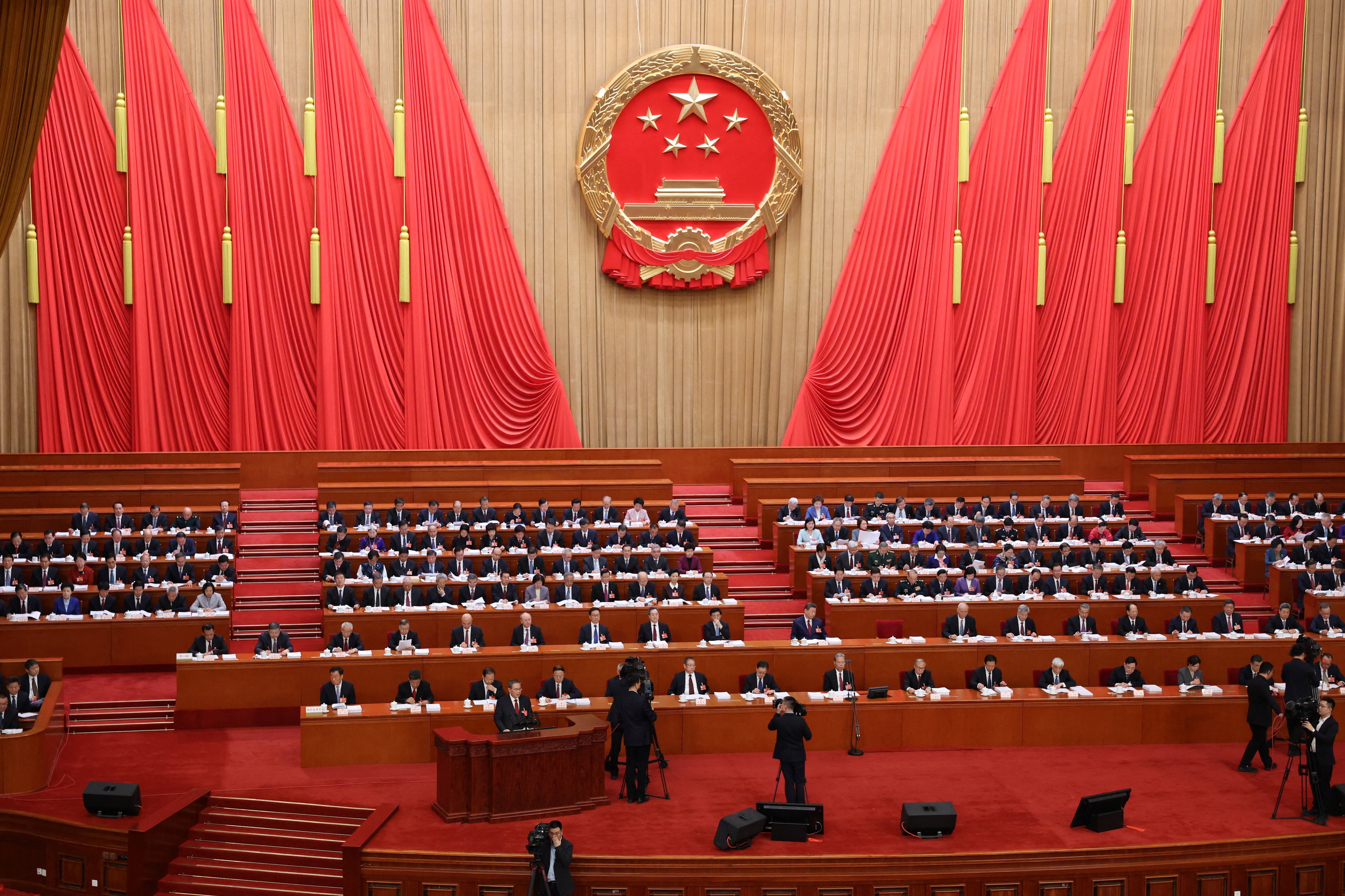 Chinese Premier Li Qiang delivers a work report during the opening session of the National People's Congress (NPC) at the Great Hall of the People in Beijing, China, March 5, 2026. REUTERS/Florence Lo/Pool