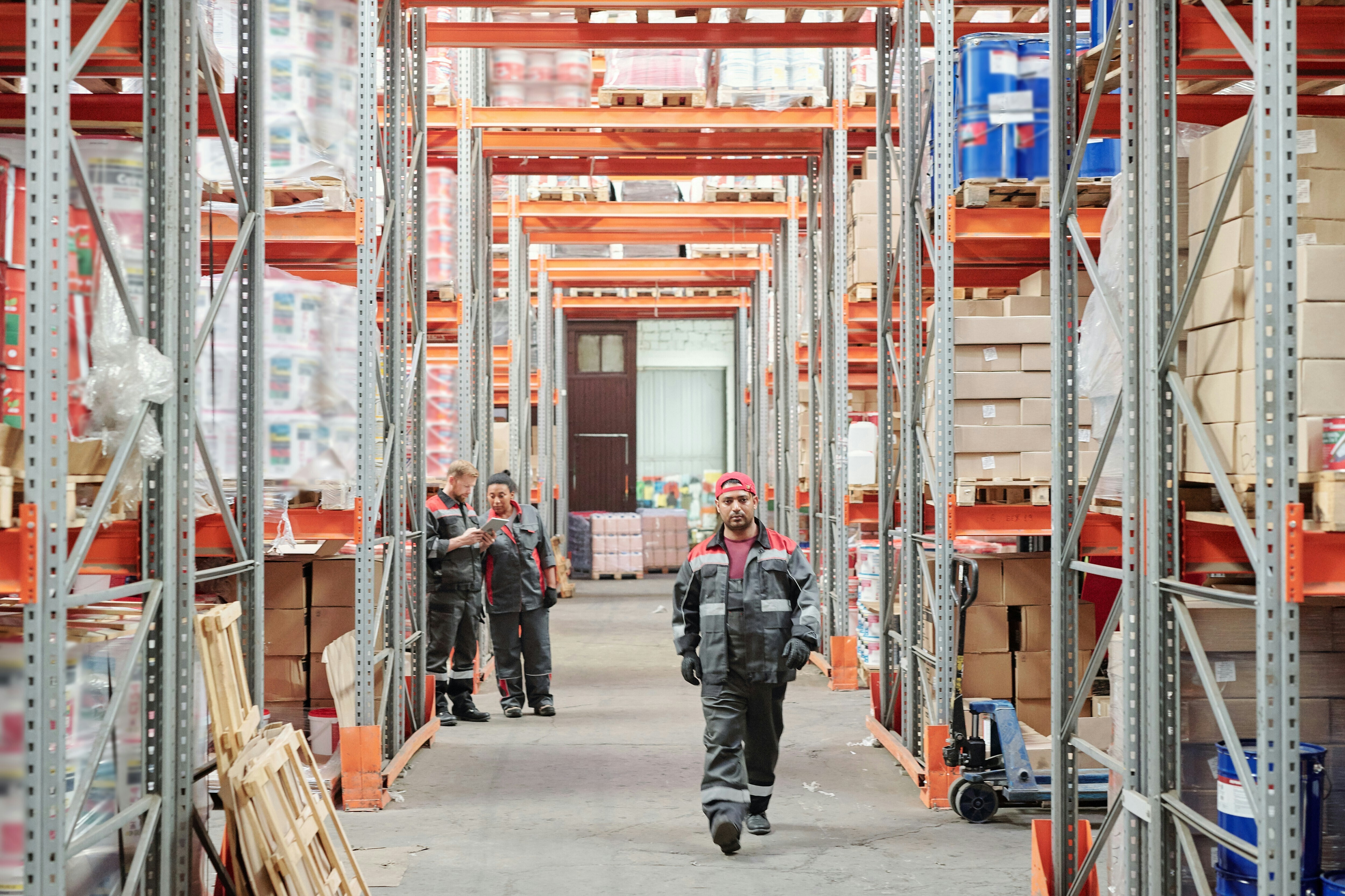 Warehouse workers in a large facility: Supply chain resilience can be aided with AI.