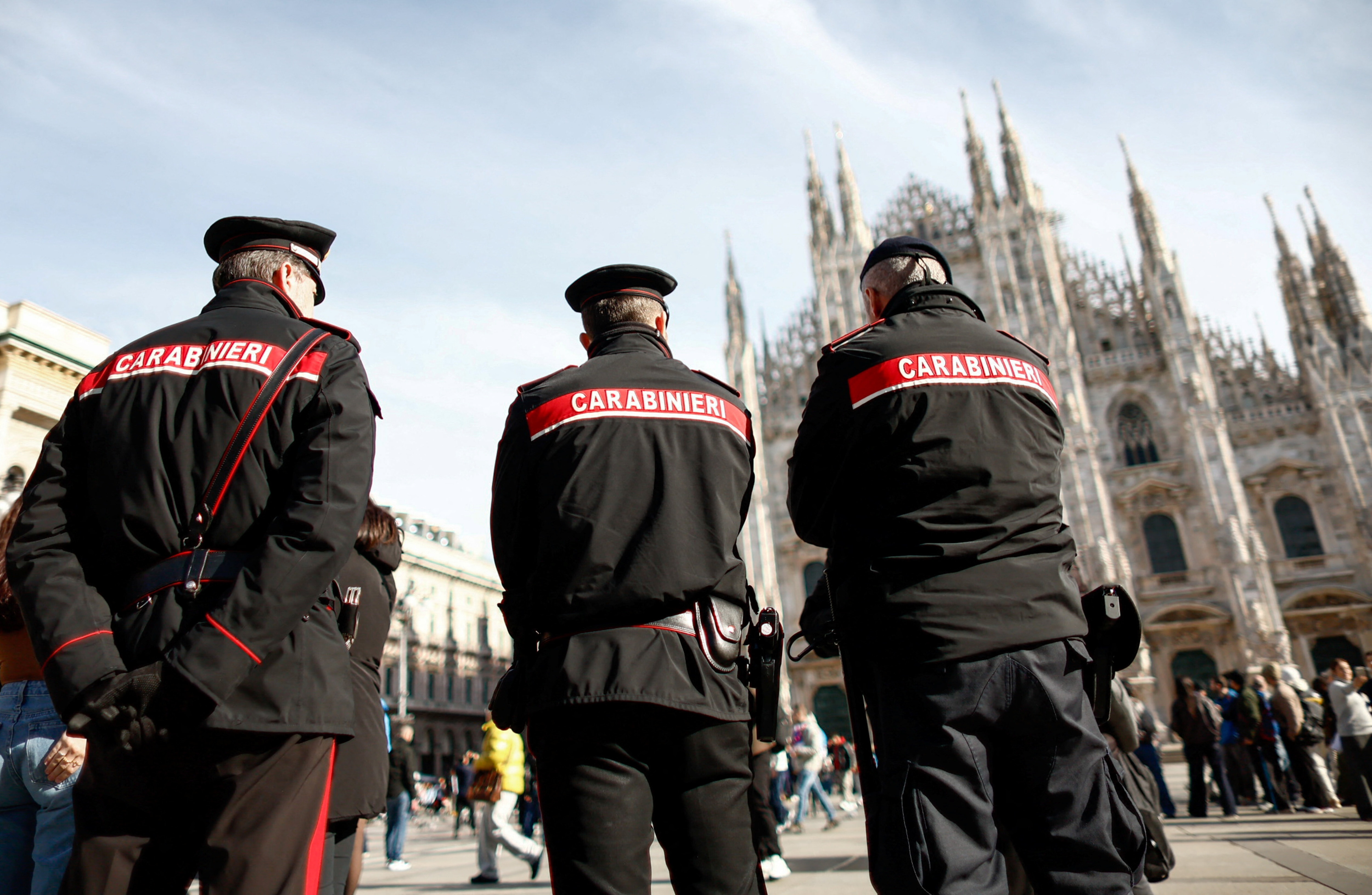 Carabinieri officers stand at Piazza del Duomo on the day of the opening ceremony of the Winter Olympics in Milan, Italy, February 6, 2026. REUTERS/Alessandro Garofalo