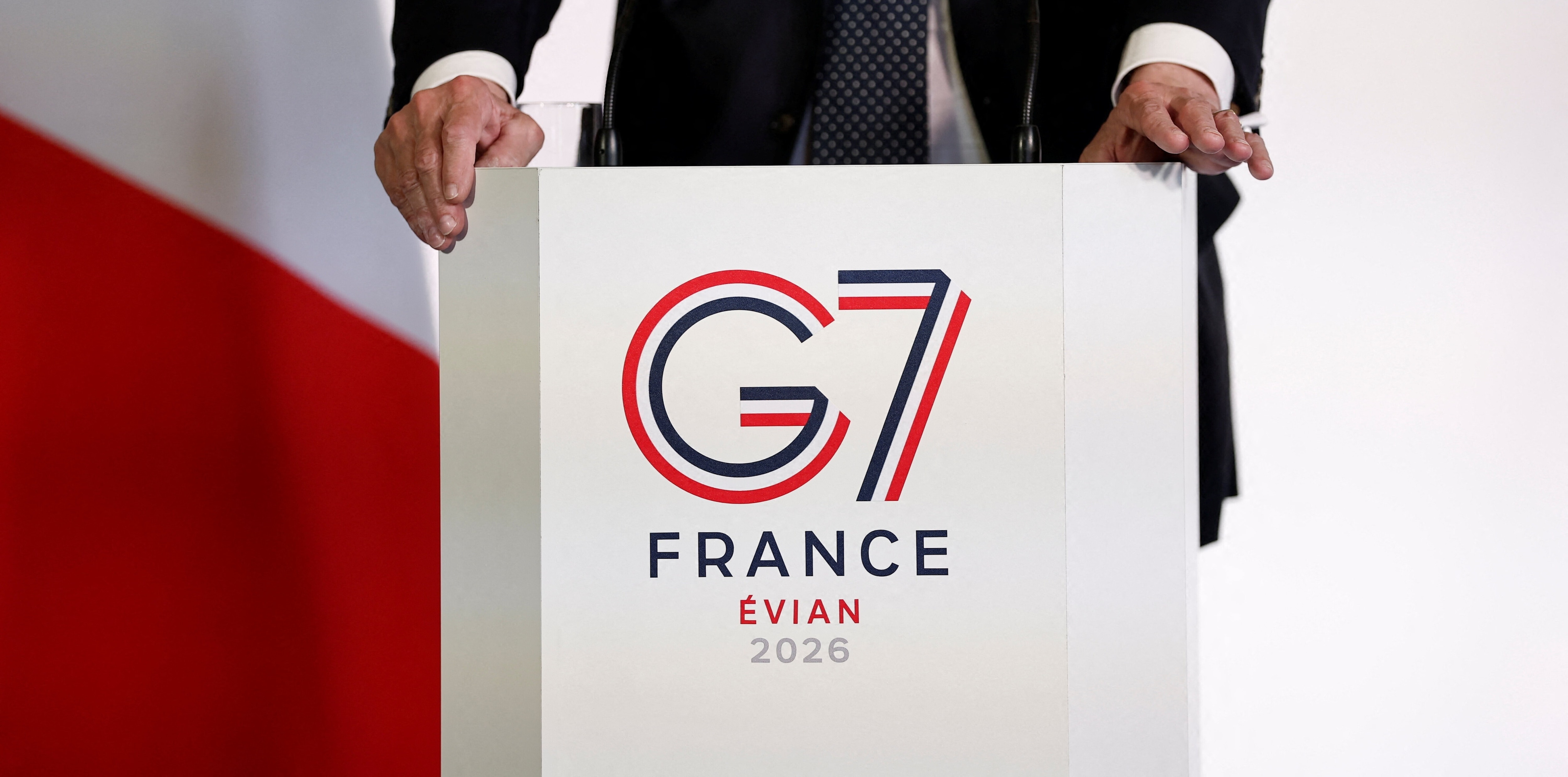 The logo of the G7 Evian summit is seen on a desk as French Junior Minister for Foreign Trade and Attractiveness Nicolas Forissier speaks during a press conference at a meeting of G7 trade ministers in Paris, France, May 6, 2026. REUTERS/Benoit Tessier/Pool