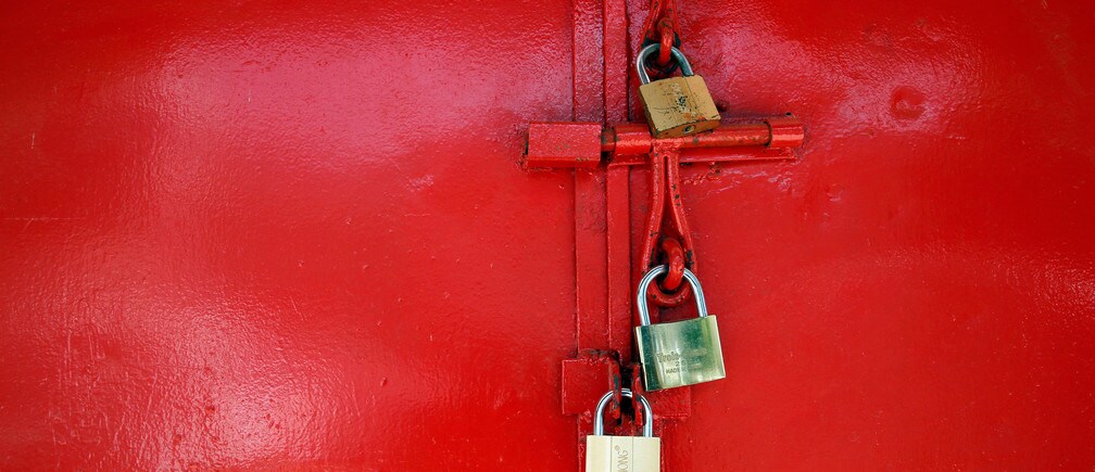 A store door locked with padlocks is seen in Banjul, Gambia January 23, 2017.