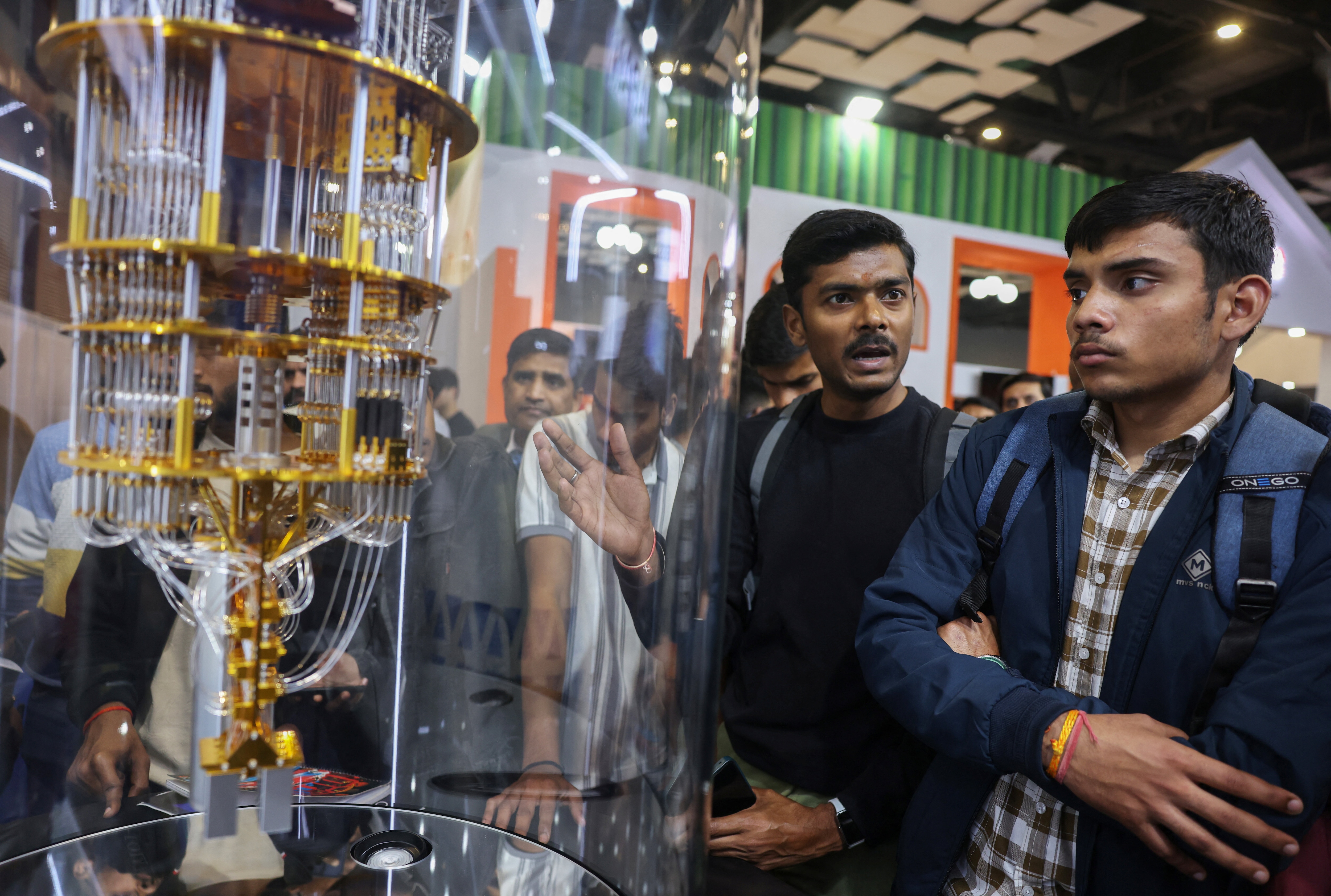 Visitors look at a scaled-down model of the inside of a quantum computer at the Japan pavilion at the AI Impact Summit, in New Delhi, India, February 20, 2026: AI for public good requires a whole ecosystem design