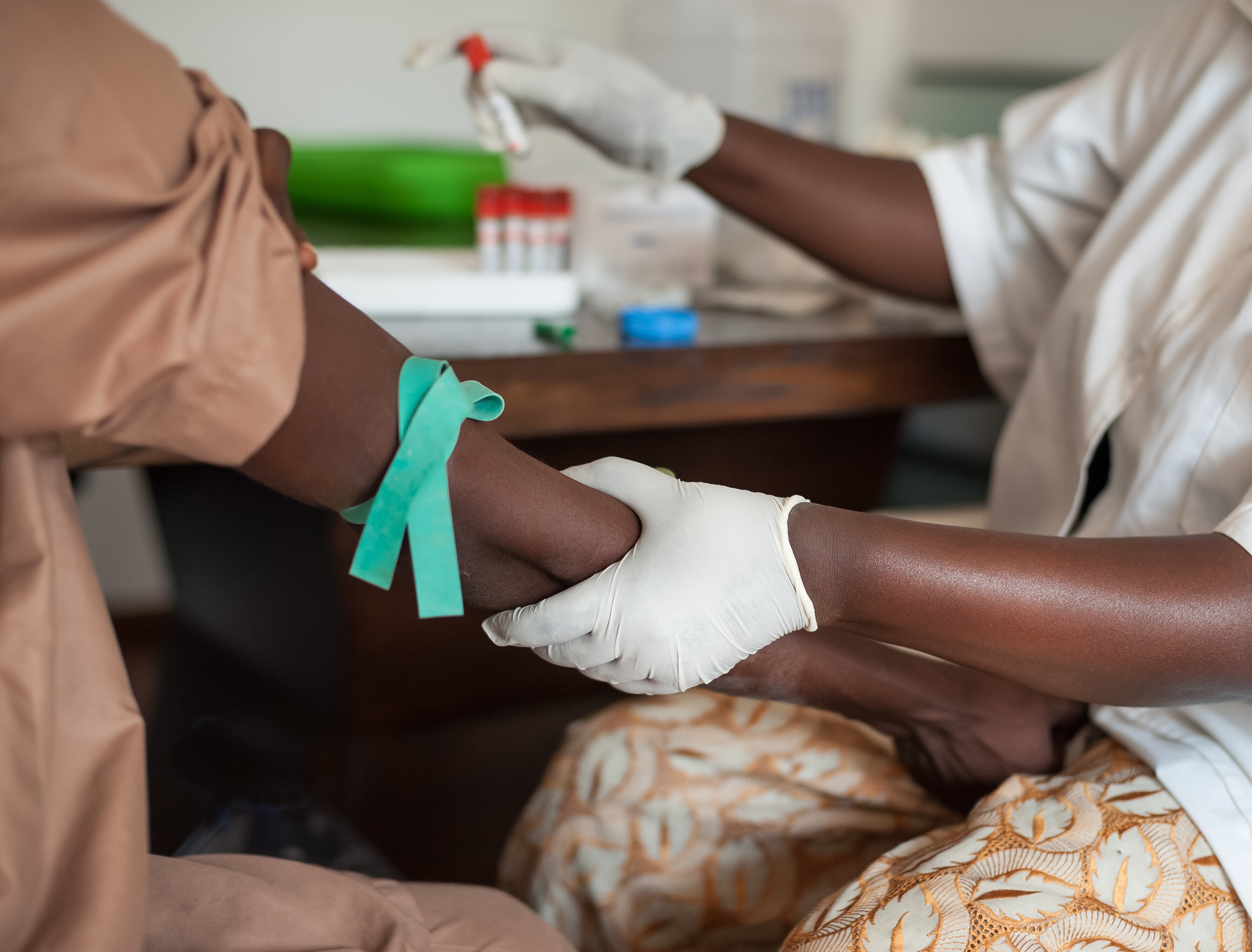A woman being treated, global health needs private sector intervention