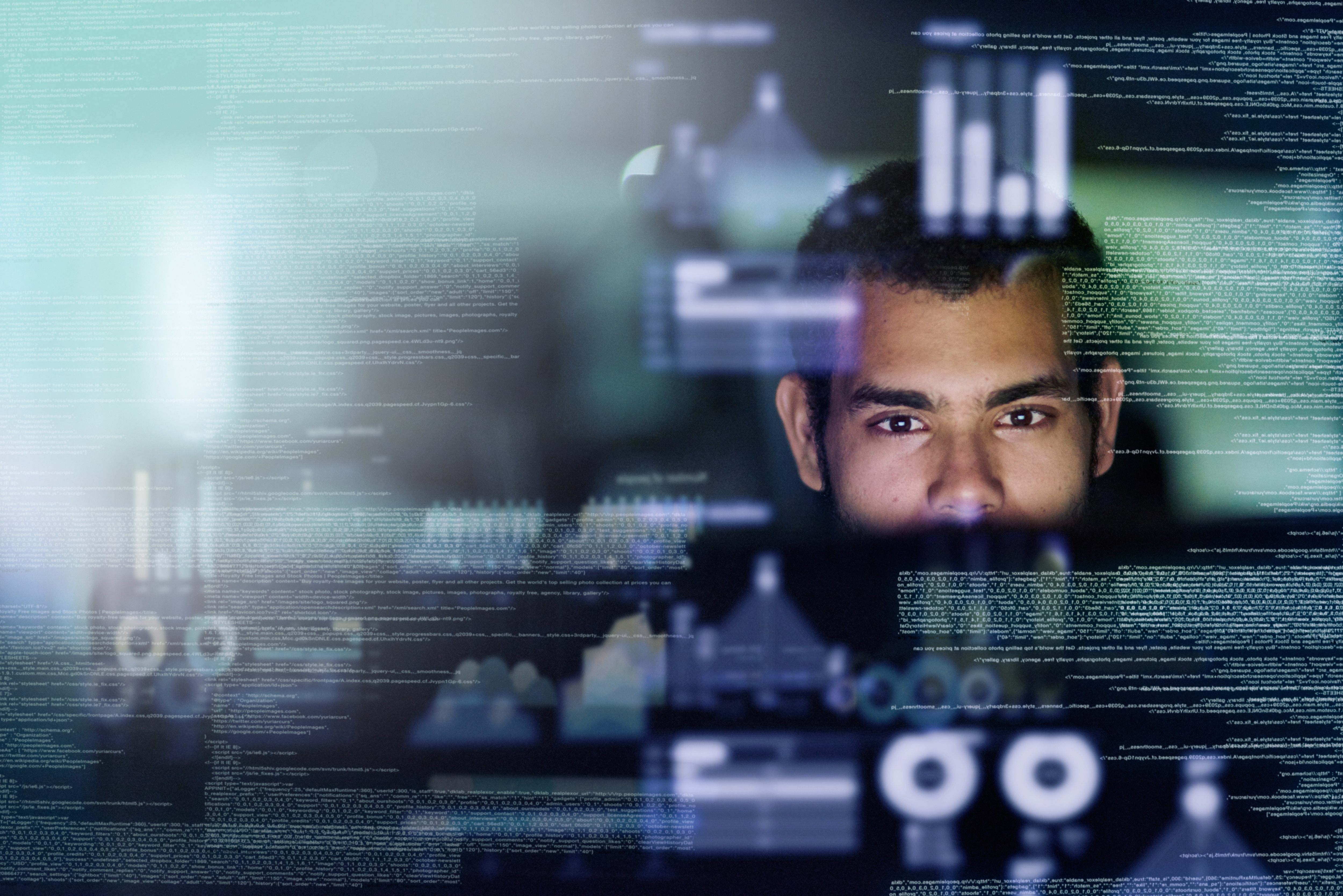 Cropped shot of a young computer programmer looking through data; cybersecurity