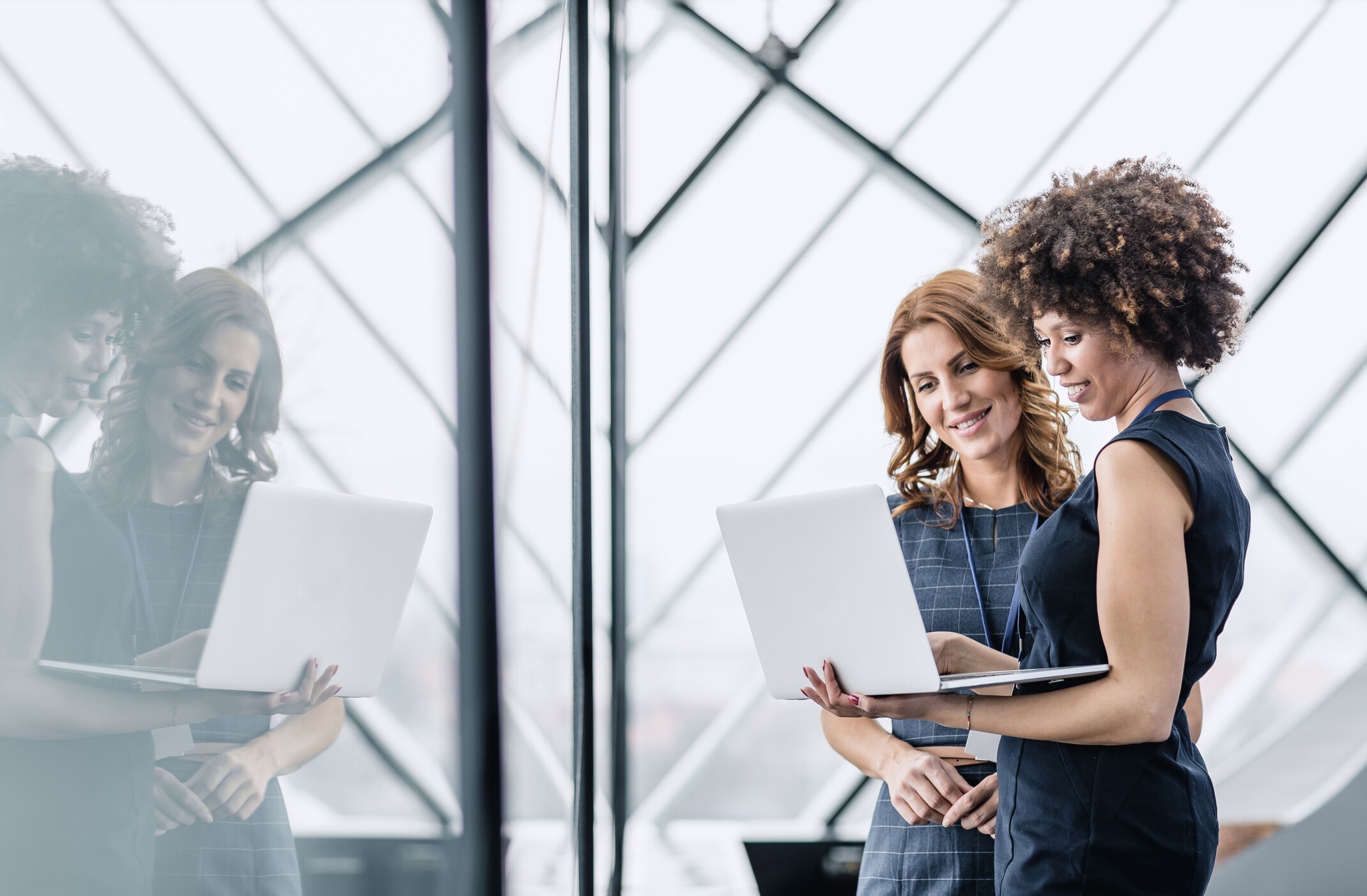 Two business women using laptop