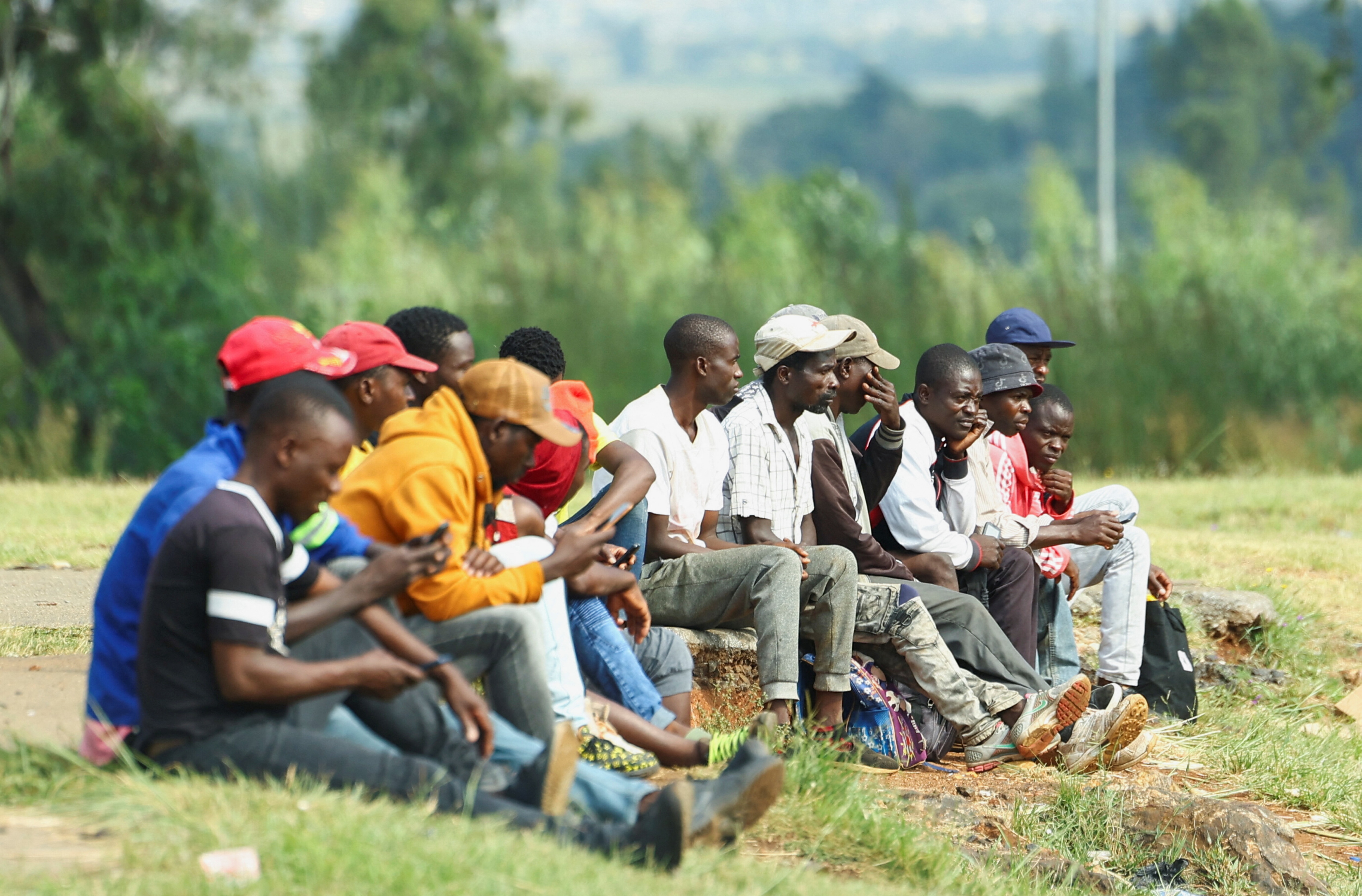 Job seekers wait beside a road for casual work offered by passing motorists in Eikenhof, south of Johannesburg, South Africa, March 4, 2024: Social enterprises are central to Africa's economic future