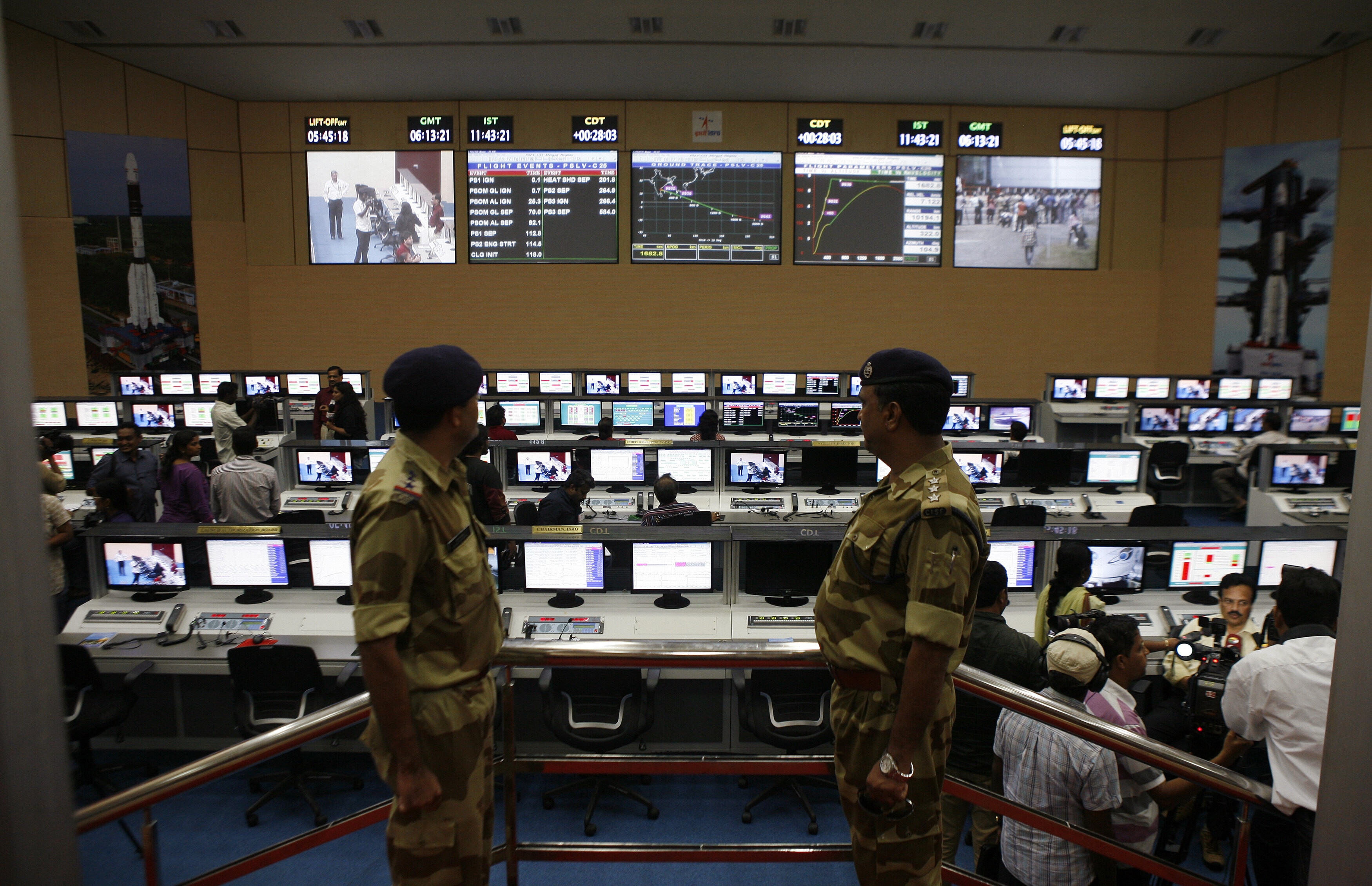 Indian security personnel stand guard inside the control station before the launch of India's Polar Satellite Launch Vehicle (PSLV-C25), carrying the Mars orbiter, at Satish Dhawan Space Centre in Sriharikota, about 100 km (62 miles) north of the southern Indian city of Chennai October 30, 2013. India launched its first rocket to Mars on November 5, 2013, aiming to put a satellite in o player in the global space race: India’s deep tech rise requires grit