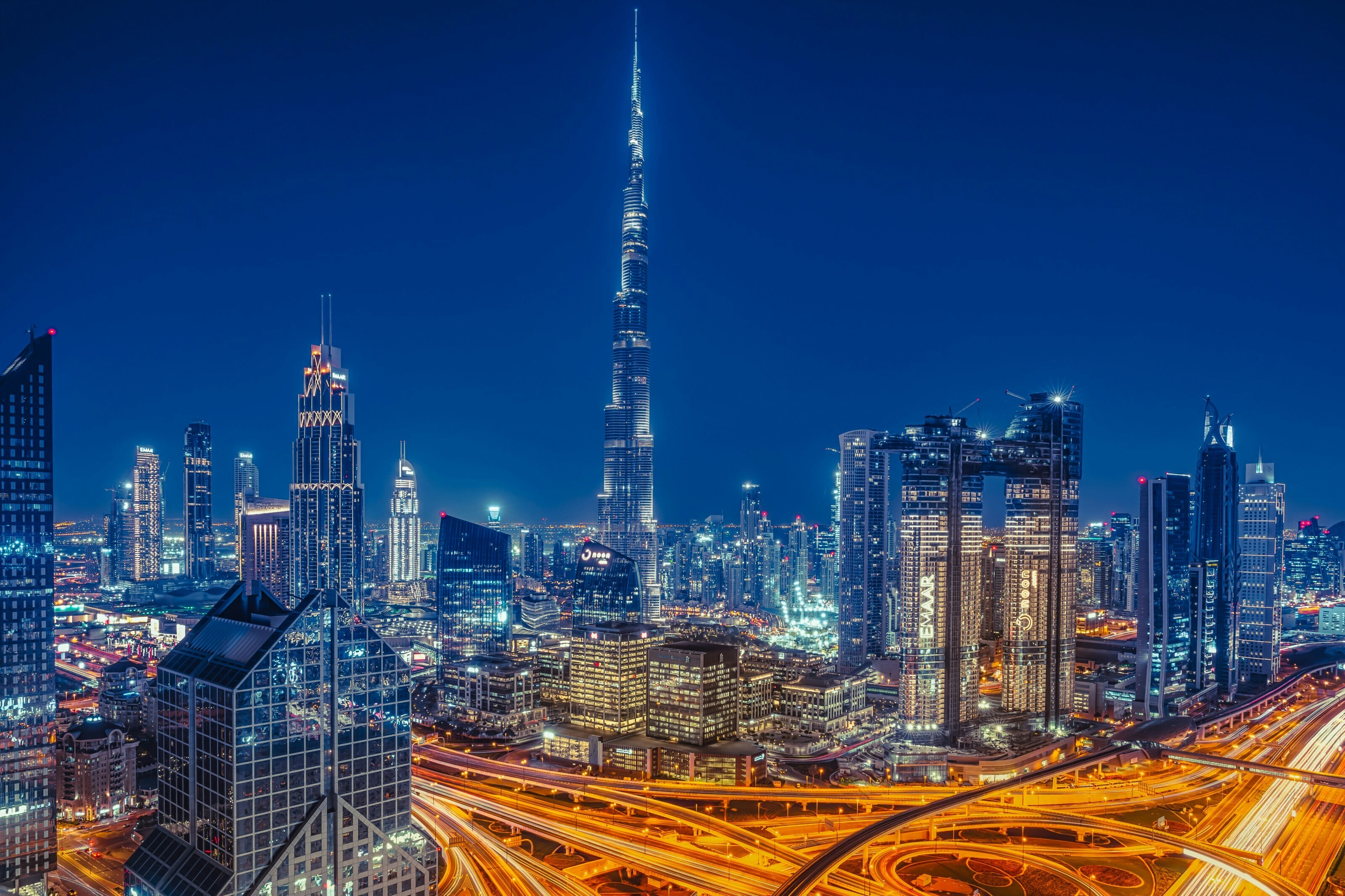 Dubai’s skyline at night, showing its dense urban landscape lit by city lights