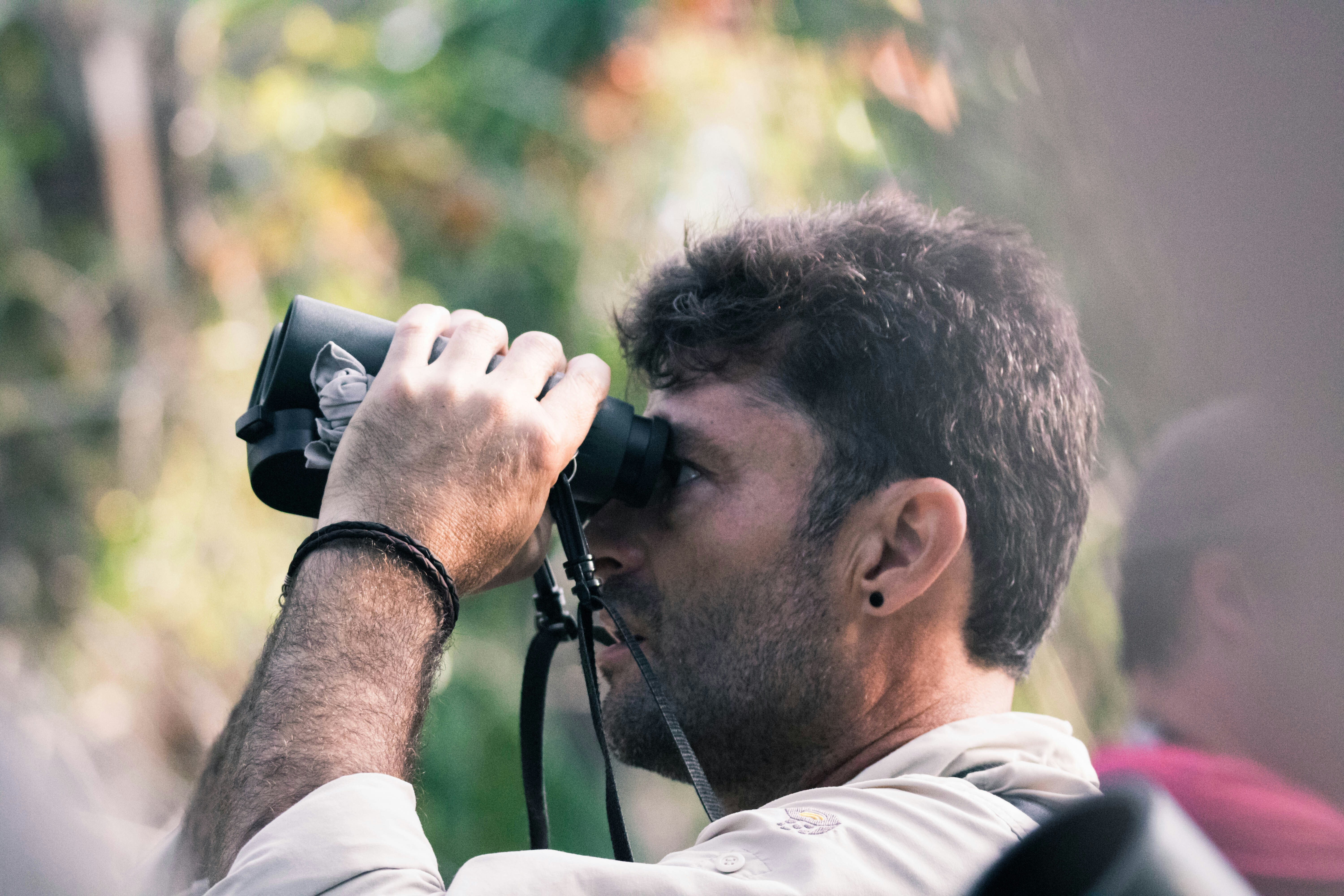 A man bird watching, citizen science