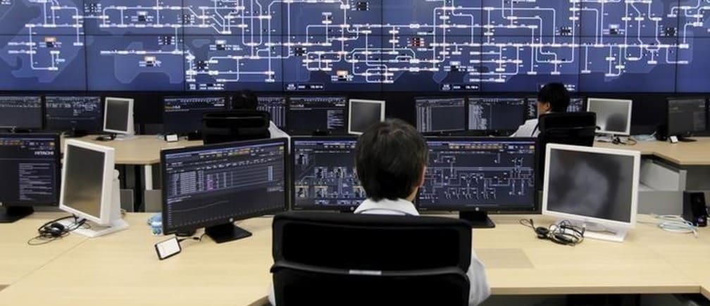 Staff work at the operations room of the Organization for Cross-regional Coordination of Transmission Operators, Japan (OCCTO) in Tokyo, Japan, March 16, 2016. Picture taken March 16, 2016.     REUTERS/Toru Hanai