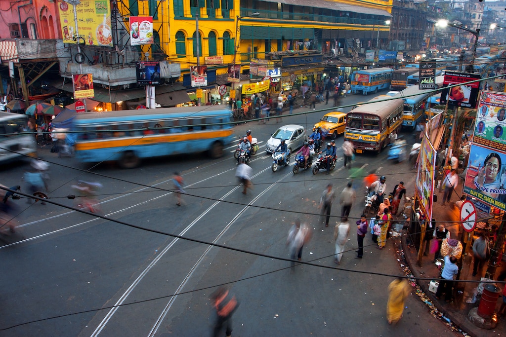 Kolkata, India - January 17, 2013: Street traffic blurred in motion at evening on January 17, 2013 in Kolkata, India. Kolkata has a density of 814.80 vehicles per km road length; hyperlocal research, energy, food and water