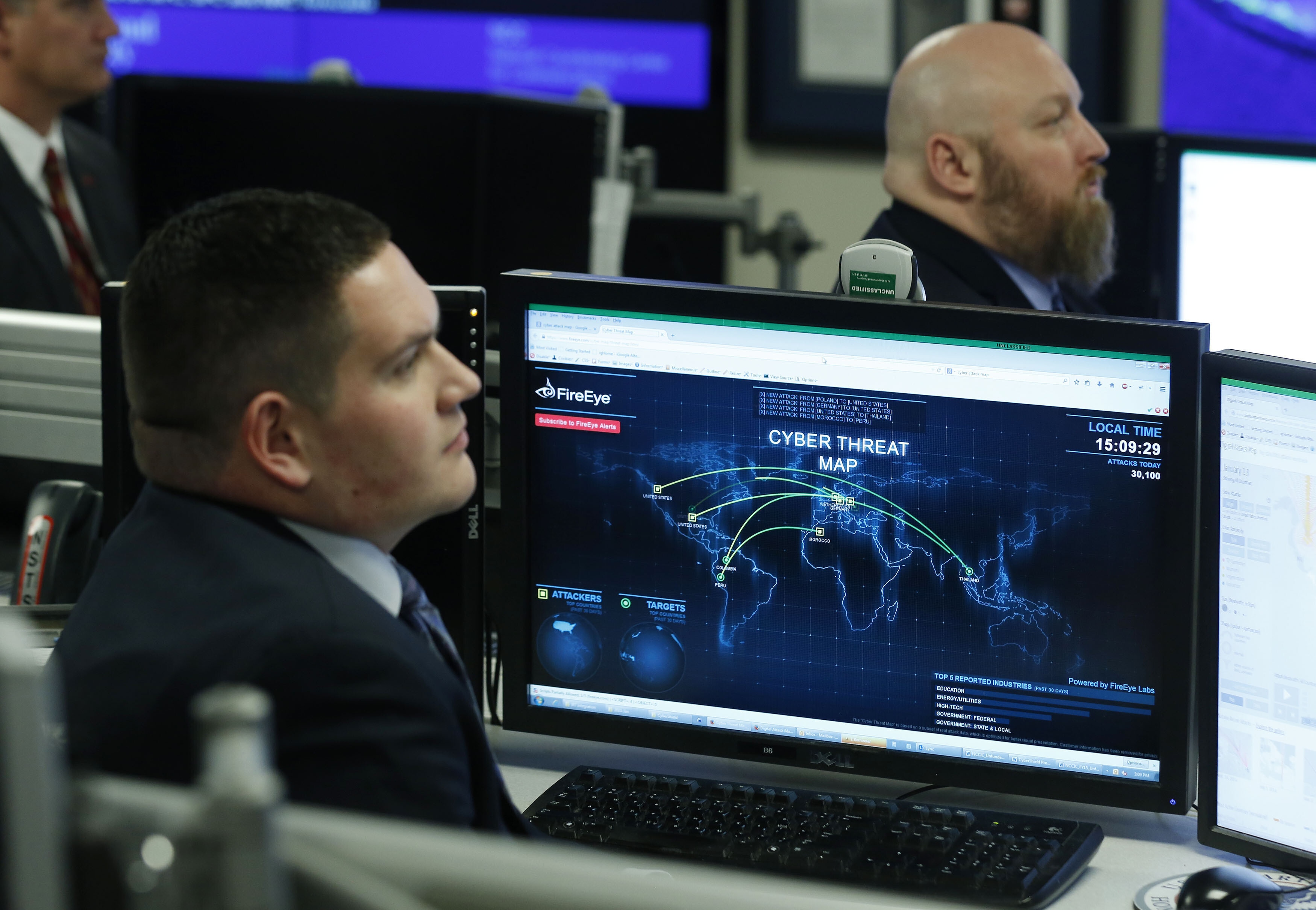 Department of Homeland Security workers listen to U.S. President Barack Obama talk at the National Cybersecurity and Communications Integration Center in Arlington, Virginia, January 13, 2015: AI is becoming an abstraction layer in cybersecurity 