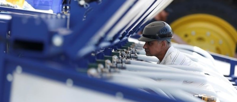 An engineer assembles a Blue River Technology See & Spray agricultural machine that combines computer vision and artificial intelligence to detect and precisely spray herbicides onto weeds in a farm field in Sunnyvale, California, April 23, 2018. Picture taken April 23, 2018. REUTERS/ Stephen Lam - RC1937E08870