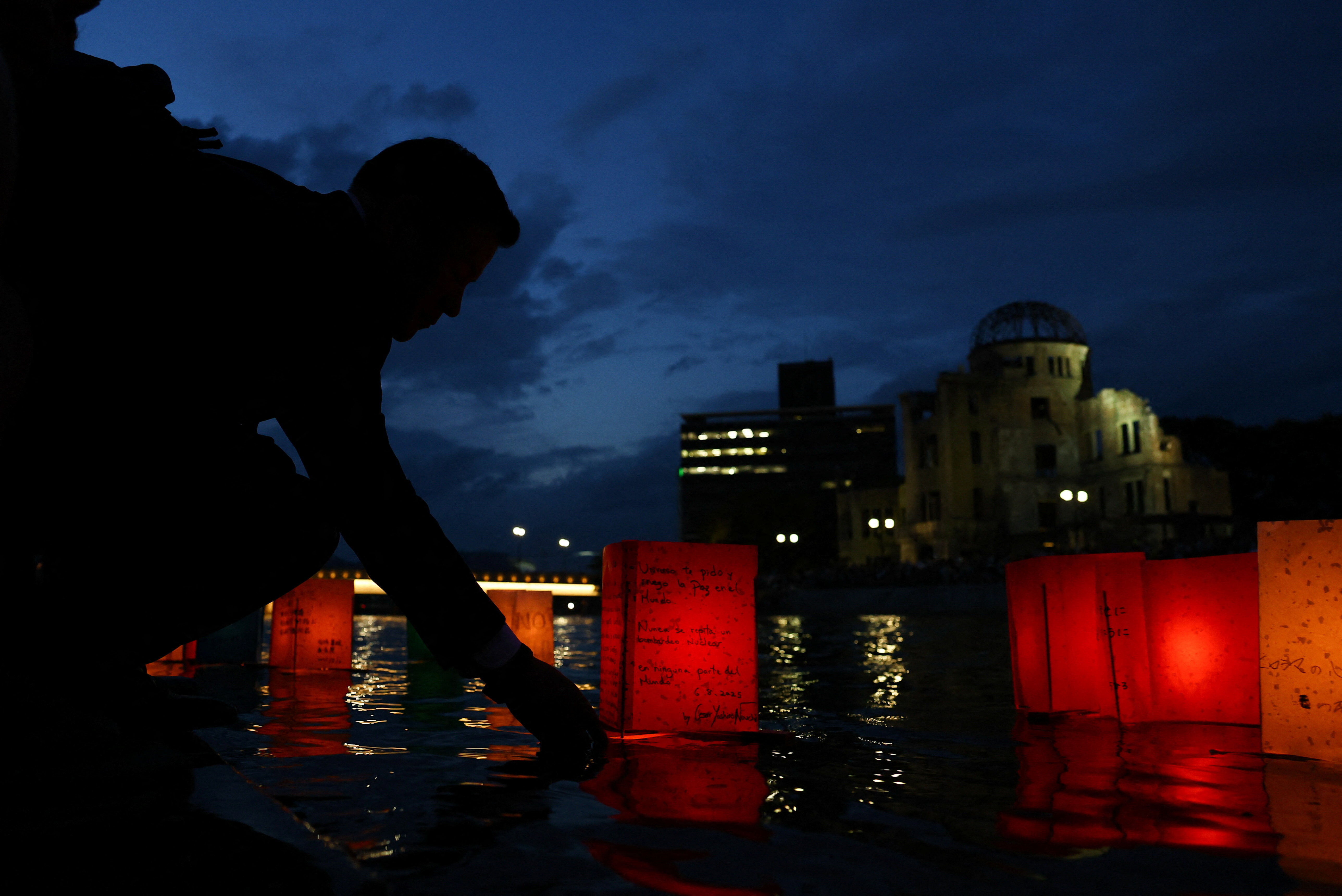 Paper lanterns are placed on on the Motoyasu River, facing the Atomic Bomb Dome, in remembrance of atomic bomb victims on the 80th Atomic Bombing Day anniversary in Hiroshima, Japan.
