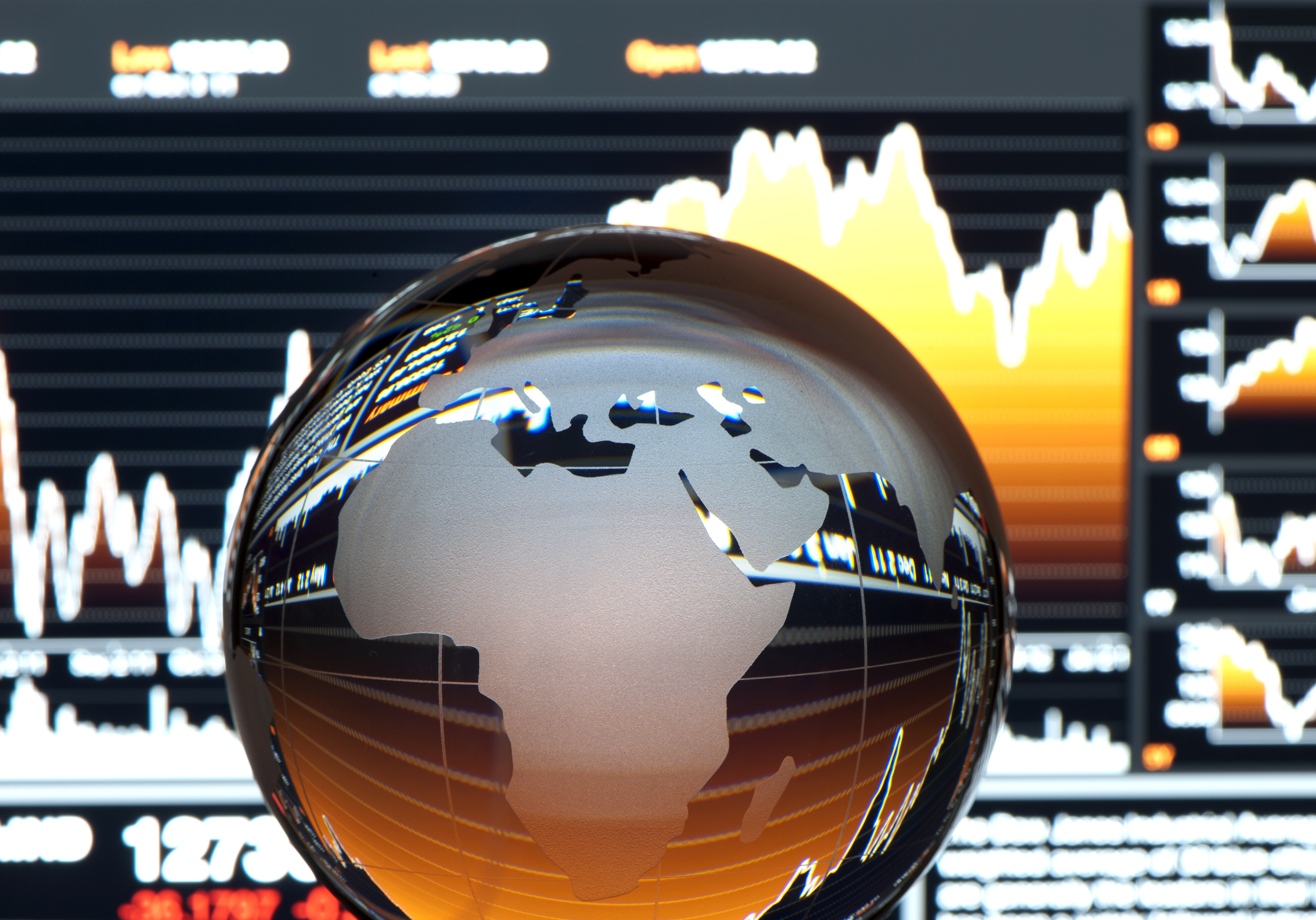 Global finance concept. Financial data with globe in foreground. Globe shows Europe: Investment in green compute can help boost AI in Africa