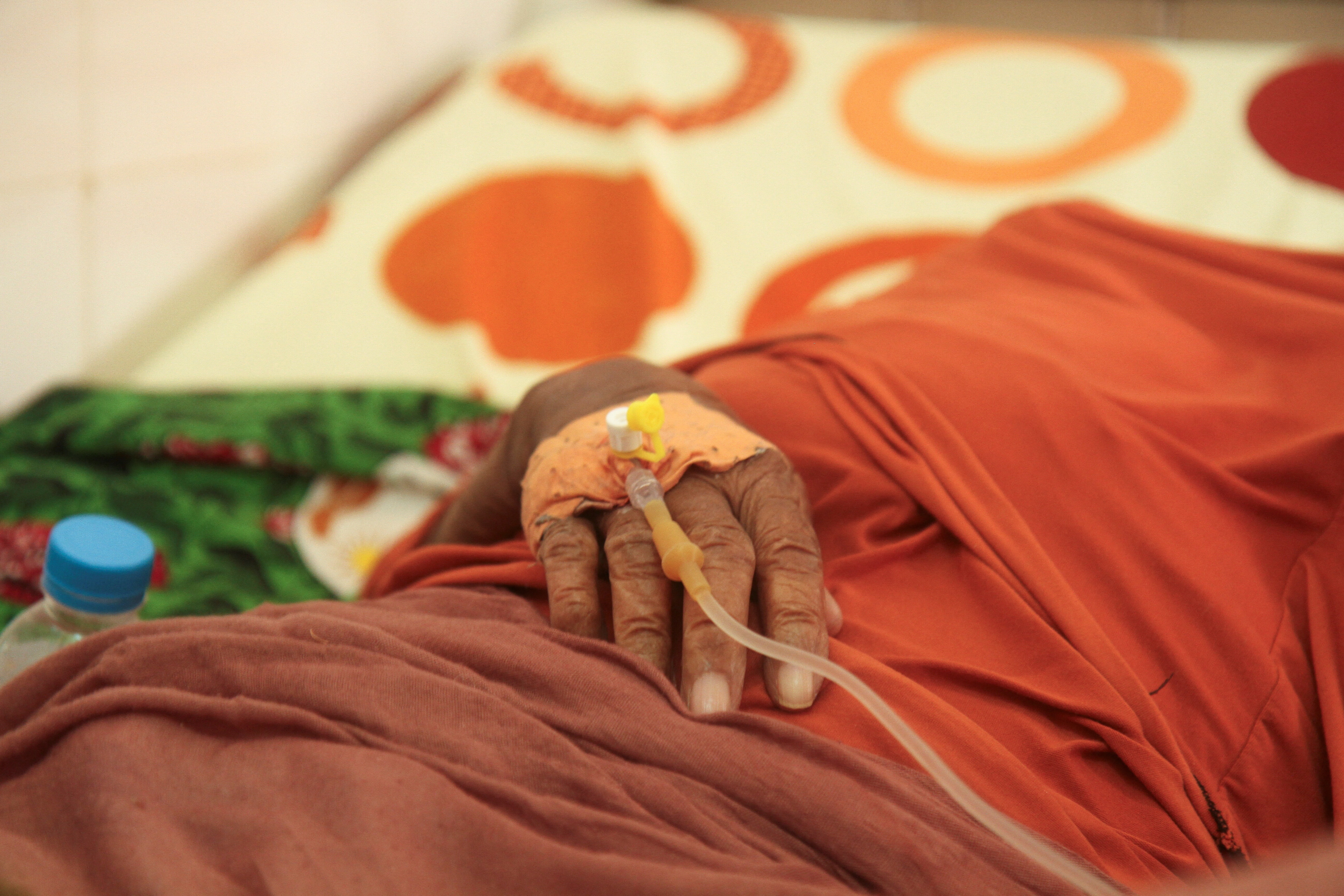 Close-up on the catheterized hand of an old woman, hospitalized for dehydration during a heat wave in Niamey, Niger, 13 April 2024.
