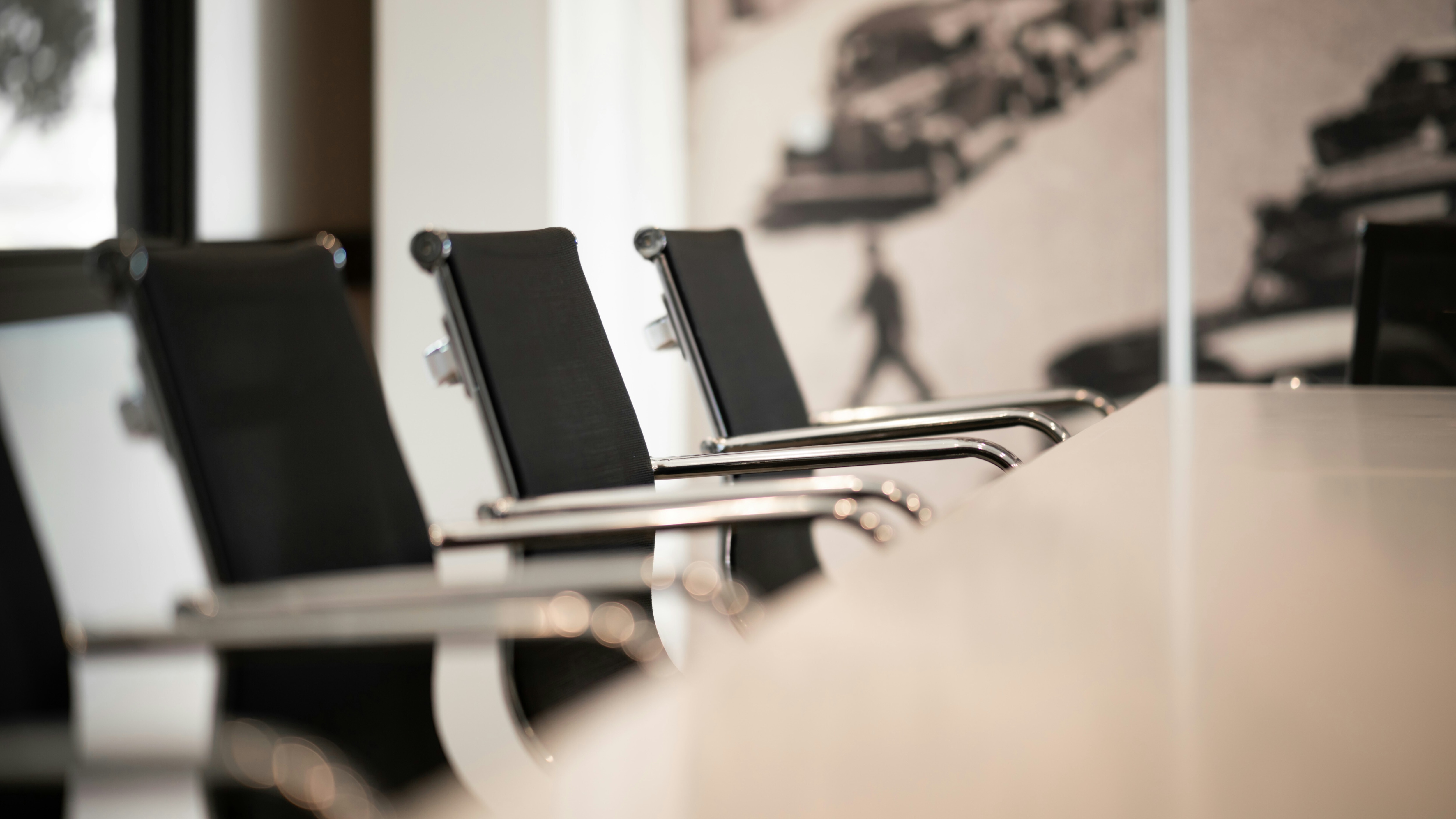 Empty seats in a boardroom.