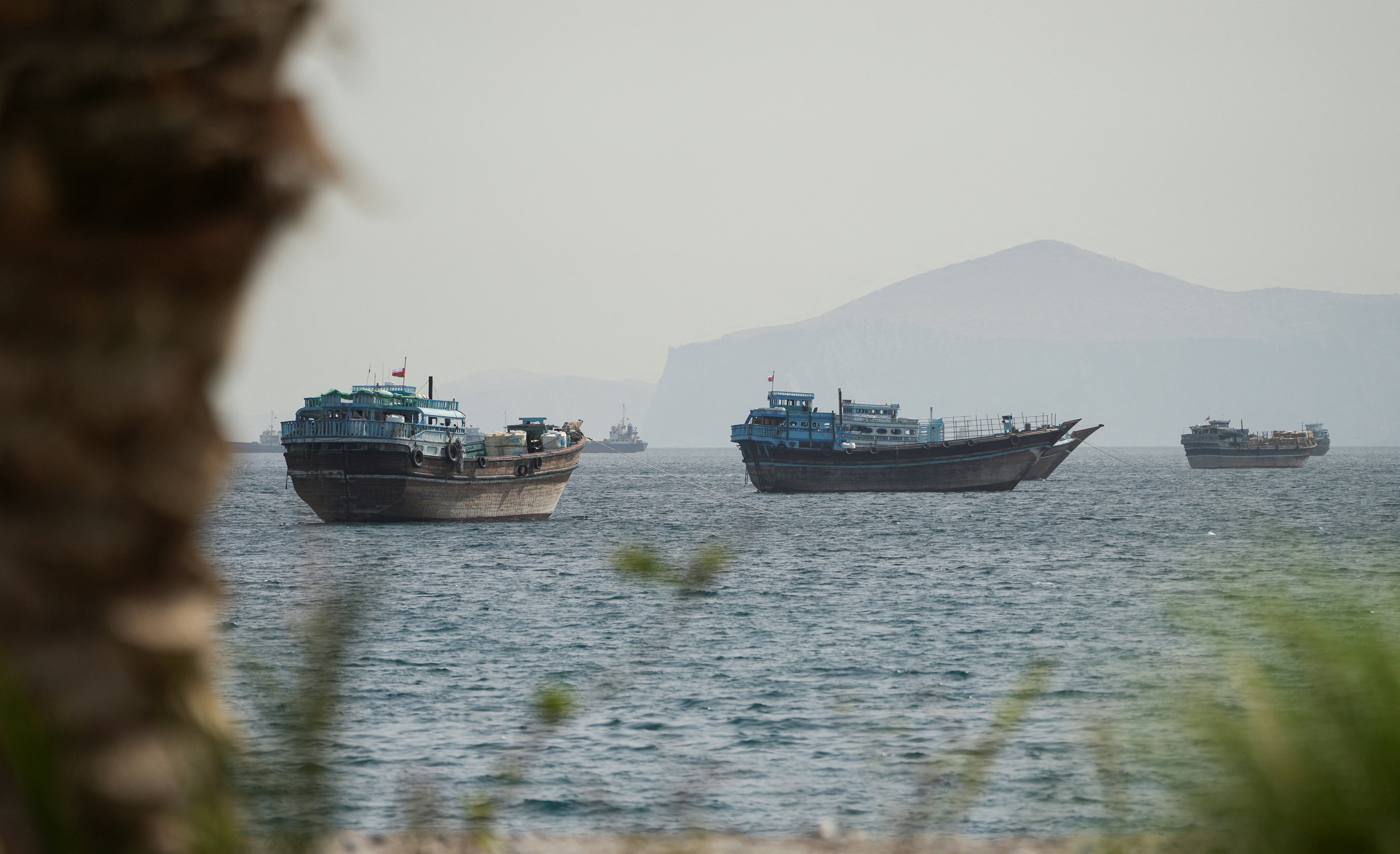 Vessels sail through the Strait of Hormuz, Musandam, Oman, May 22, 2026. 
