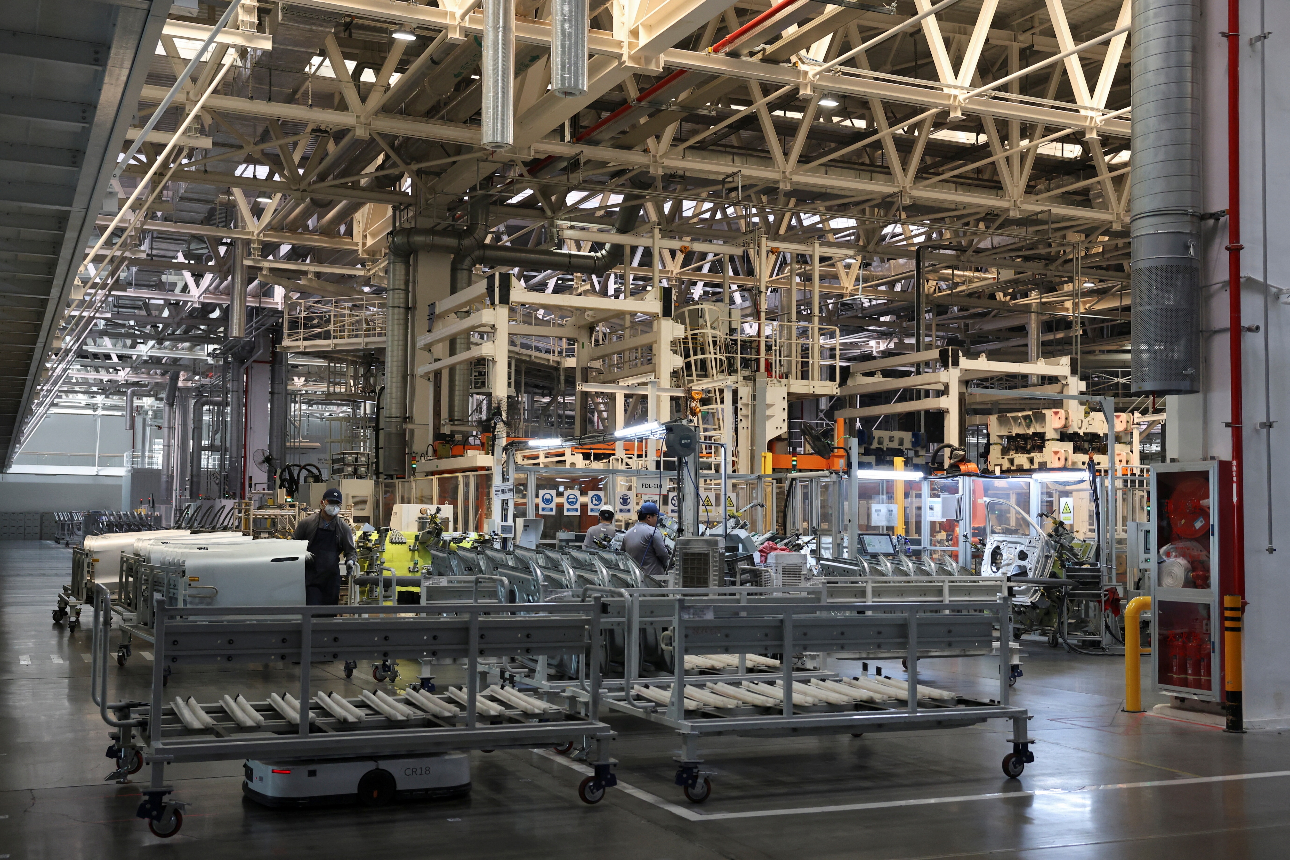 An automated guided vehicle (AGV) transports carts on the production line at a factory of Chinese electric vehicle (EV) maker Nio in Hefei, Anhui province, China April 2, 2025. REUTERS/Florence Lo
