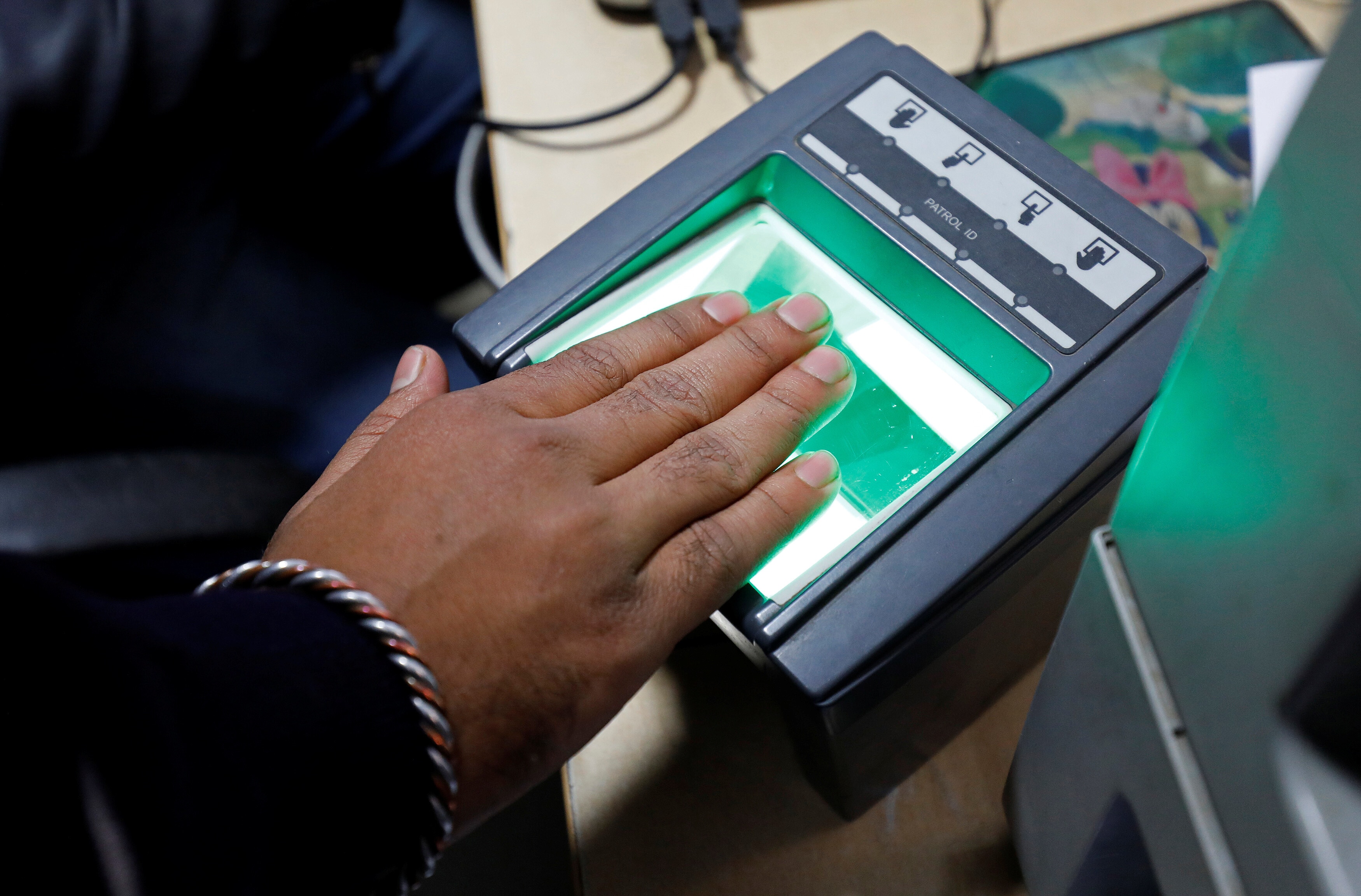 A woman goes through the process of finger scanning for the Unique Identification (UID) database system, also known as Aadhaar, at a registration centre in New Delhi, India, January 17, 2018. GovTech Compass Picture taken January 17, 2018. REUTERS/Saumya Khandelwal