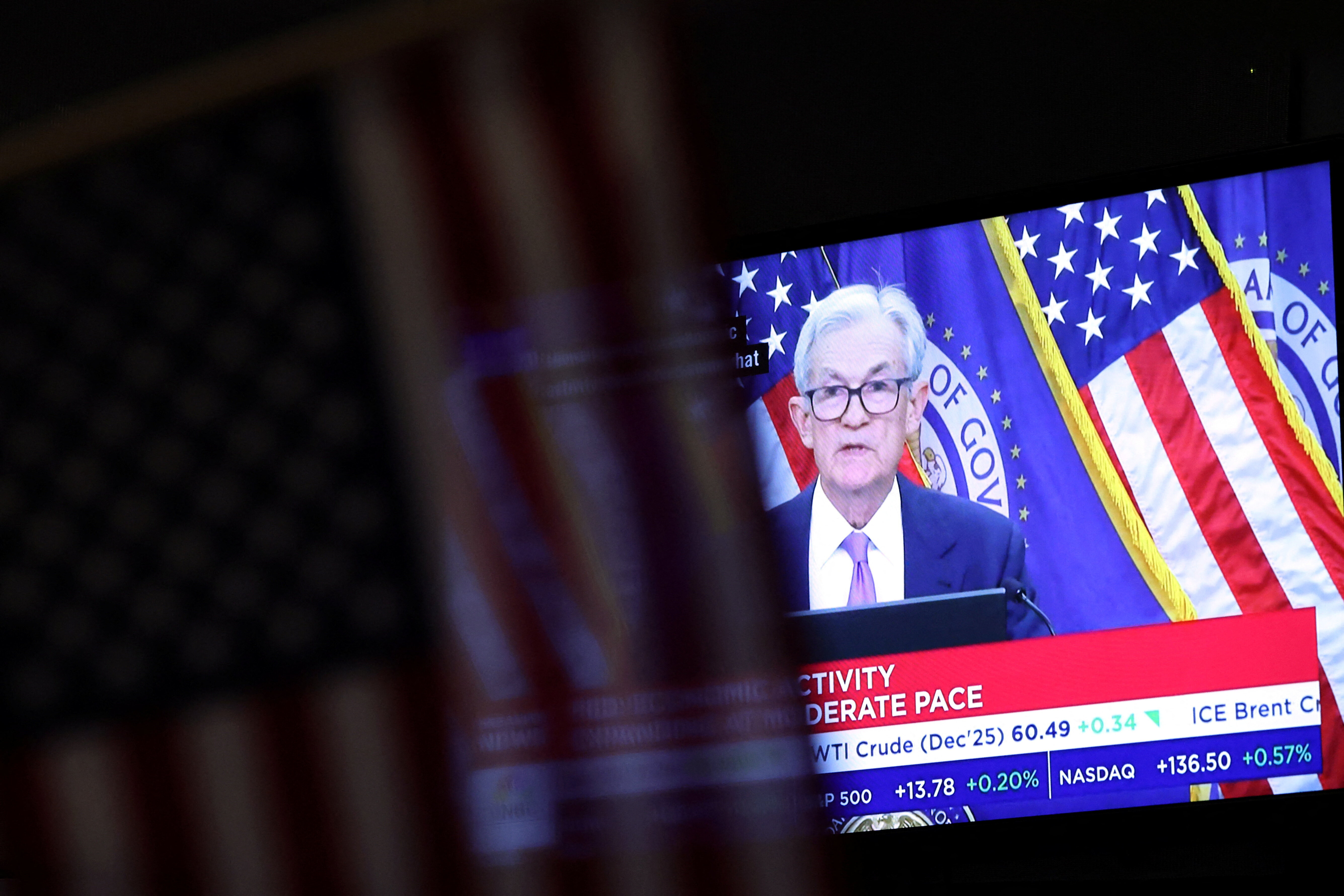 A screen broadcasts a press conference by U.S. Federal Reserve Chair Jerome Powell following the Fed rate cut announcement, on the floor of the New York Stock Exchange (NYSE) in New York City, U.S., October 29, 2025.  REUTERS/Brendan McDermid