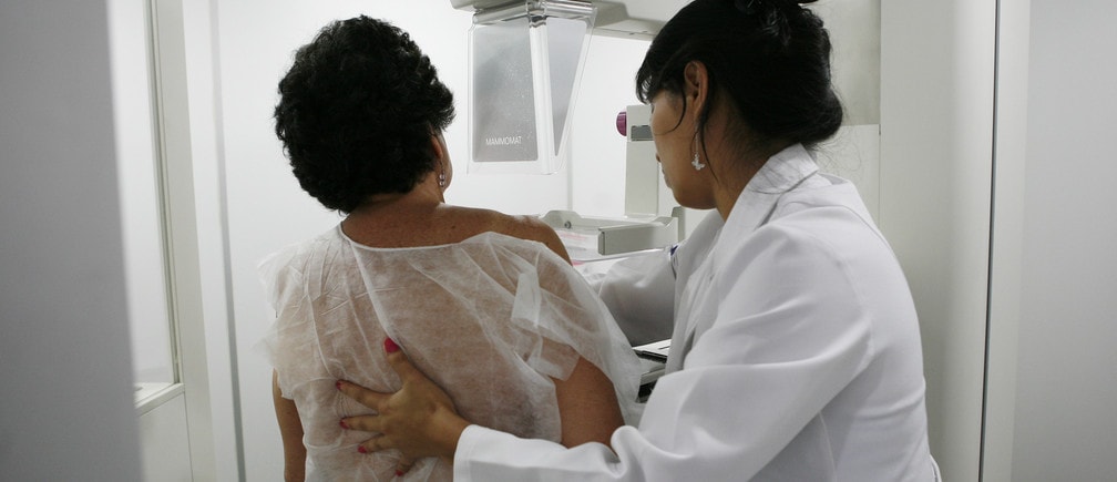 A woman undergoes a free mammogram inside Peru's first mobile unit for breast cancer detection, in Lima March 8, 2012. International Women's Day falls on March 8. REUTERS/Enrique Castro-Mendivil (PERU - Tags: HEALTH) - GM1E8390T4I01