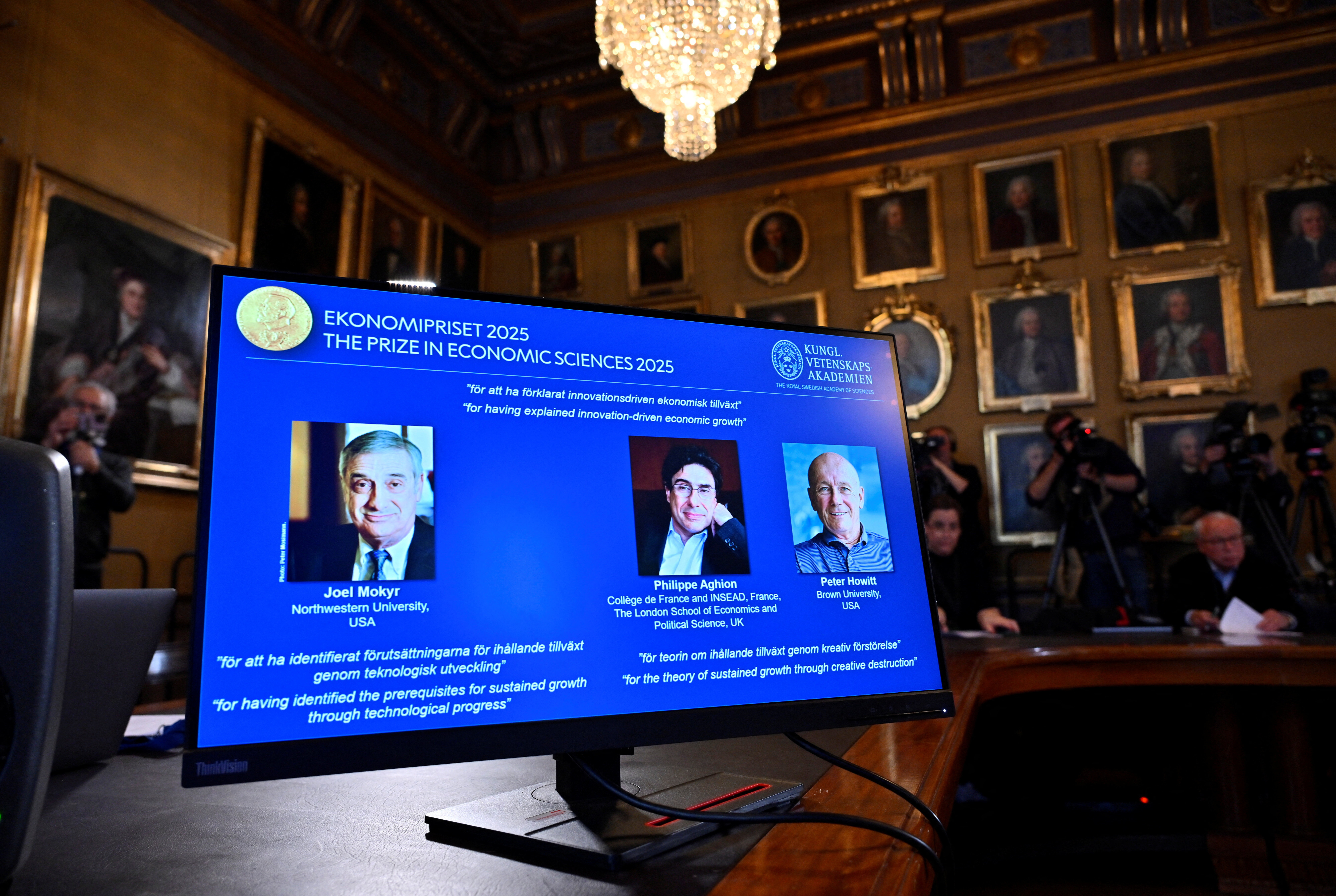 The Nobel Prize in Economics 2025 is awarded to Joel Mokyr, Northwestern University, Evanston, Illinois, U.S., Philippe Aghion, College de France and INSEAD, Paris, France, and The London School of Economics and Political Science, UK, and Peter Howitt, Brown University, Providence, Rhode Island, U.S., The Sveriges Riksbank Prize in Economic Sciences in Memory of Alfred Nobel, the Nobel Prize in Economic Sciences 2025, is presented during a press conference at the Royal Swedish Academy of Sciences in Stockholm, Sweden on Monday 13 October 2025. Anders Wiklund/TT News Agency/via REUTERS      ATTENTION EDITORS - THIS IMAGE WAS PROVIDED BY A THIRD PARTY. SWEDEN OUT. NO COMMERCIAL OR EDITORIAL SALES IN SWEDEN.
