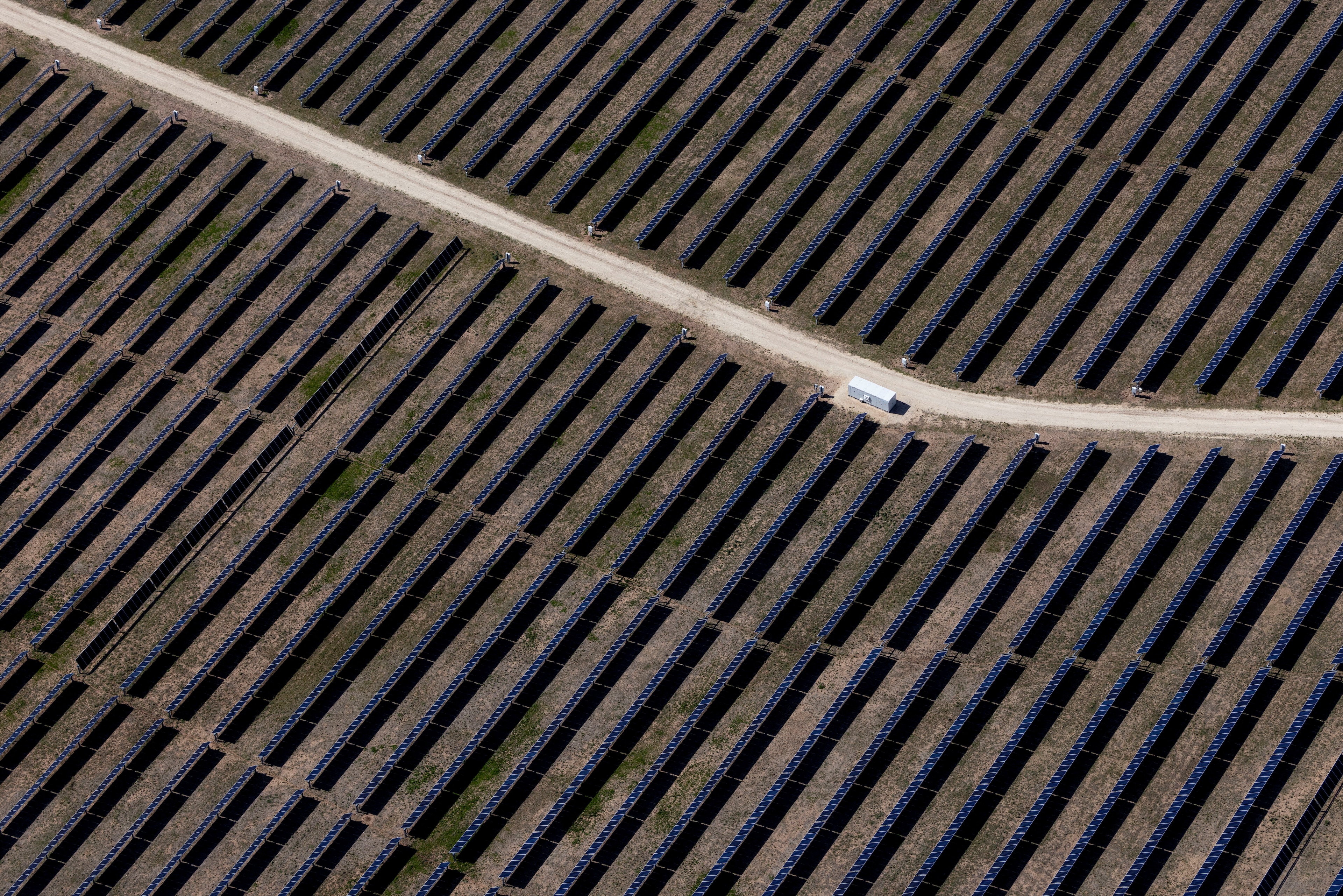 An aerial view shows rows of solar panels at a solar farm in Anson, Texas, US, April 23, 2025: Managing the energy, food and water nexus will require systems-level leadership