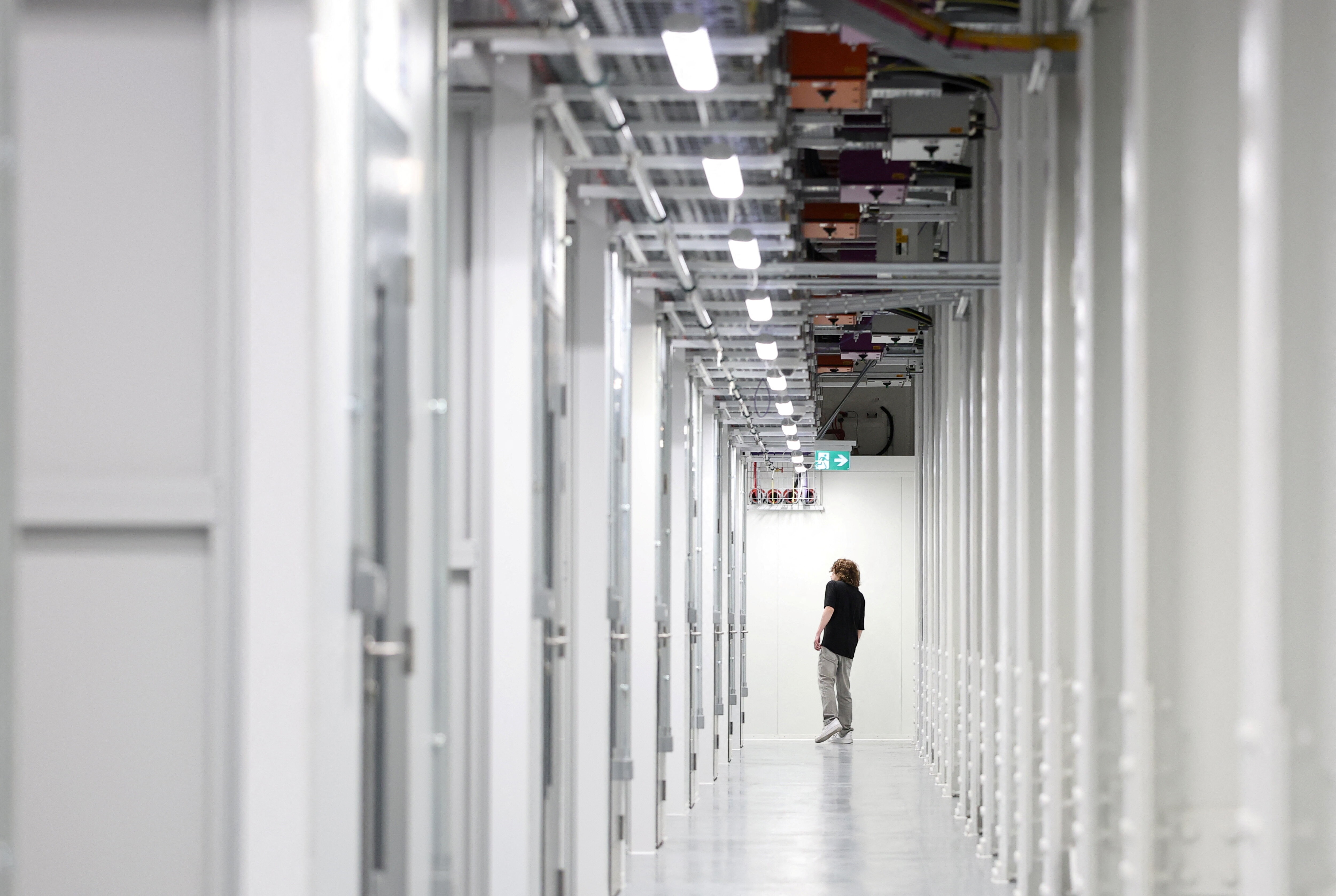 An IT technician walks inside the Nebius AI UK data centre, a new facility hosting NVIDIA and other computer firms, at Ark Data Centres, in Chertsey, Britain, November 6, 2025: AI is hitting a memory wall