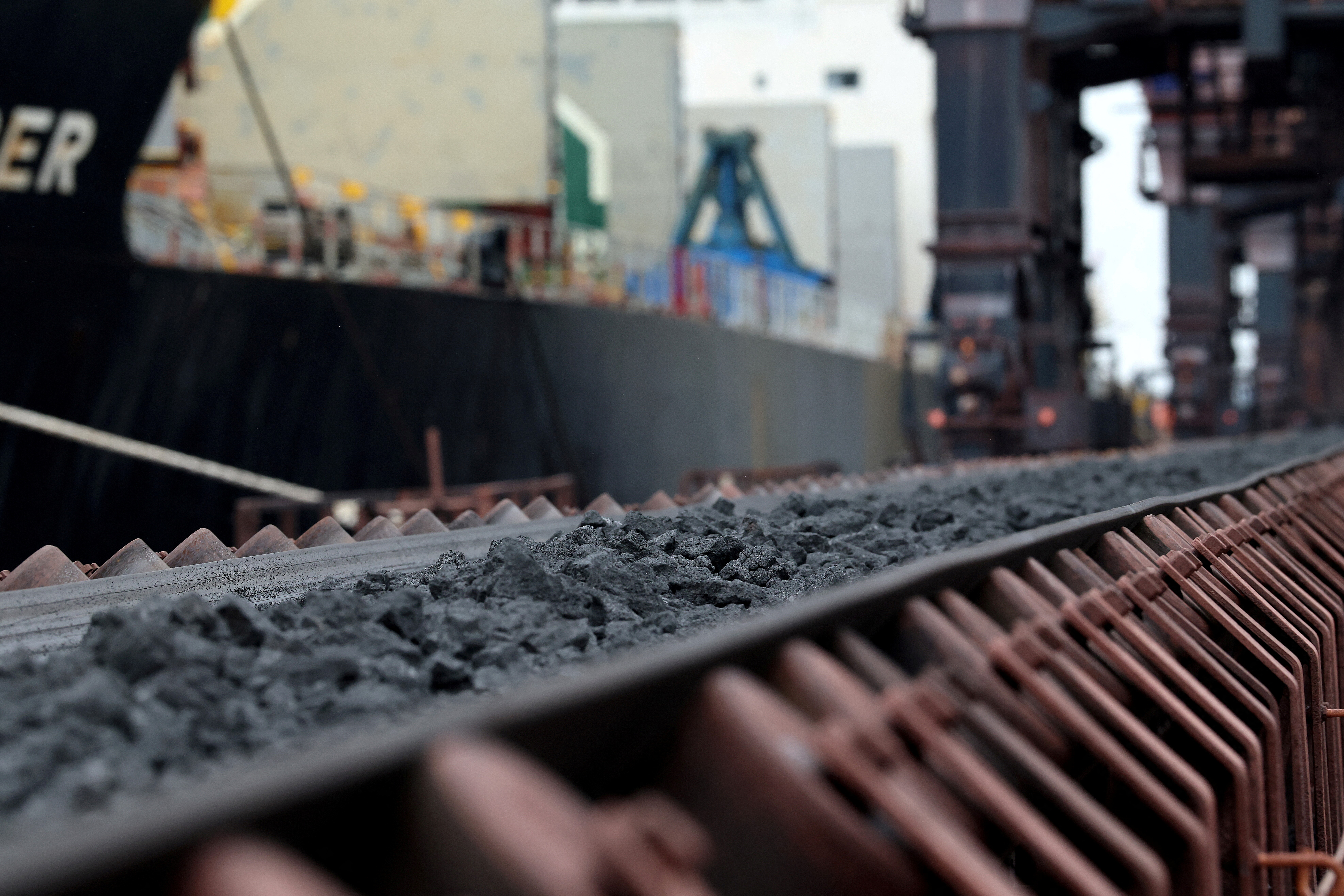 Coking coal is unloaded at Immingham Port, northern England, on April 15, 2025 as raw materials that had been waiting in the dock are transported to British Steel's steelworks site after payment was settled.