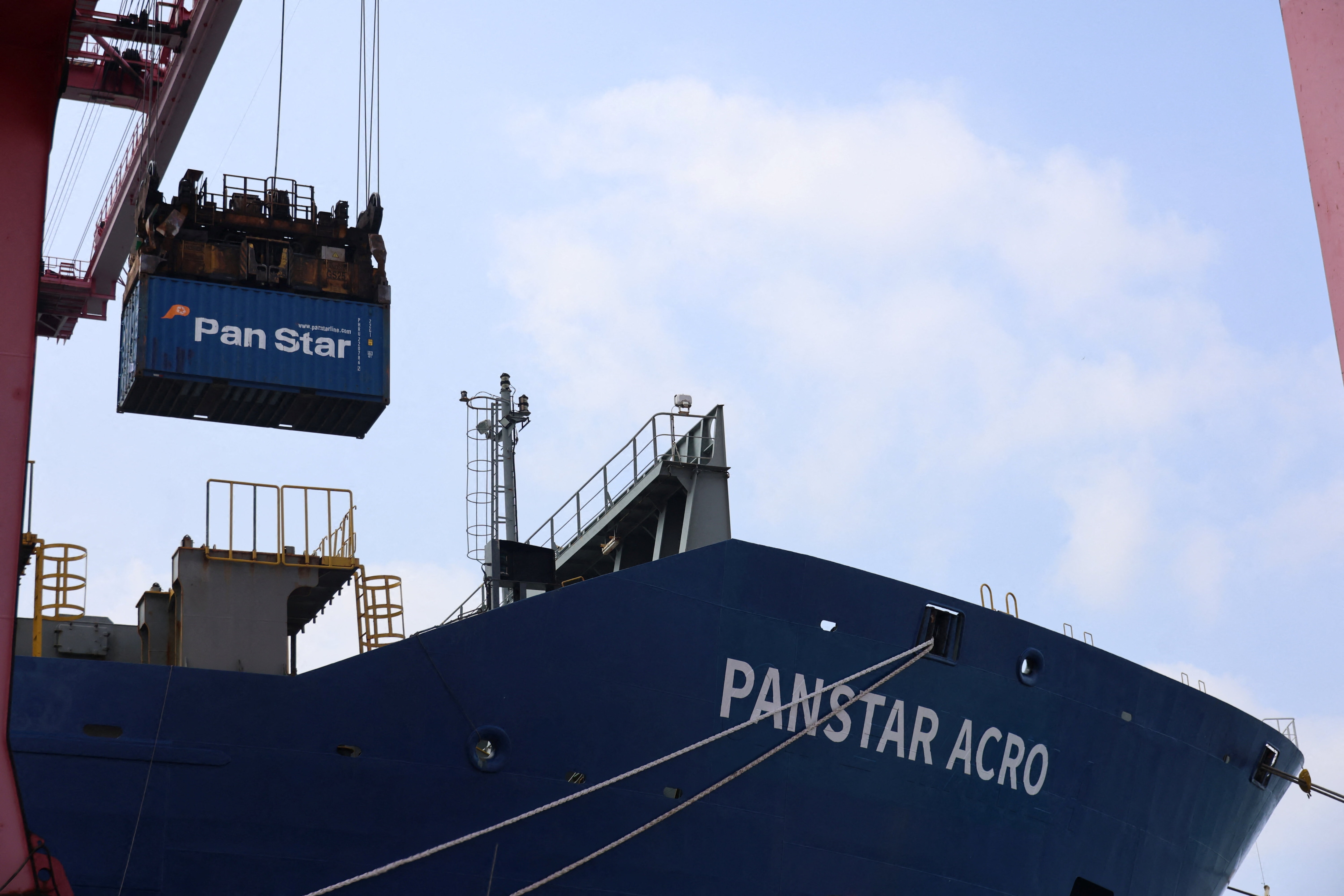 A shipping container is loaded onto the PanStar Acro, container ship bound for Europe via the Arctic, testing whether a route opened by melting sea ice can be commercially viable, at a port in Busan, South Korea, August 22, 2026.   Yonhap via REUTERS   THIS IMAGE HAS BEEN SUPPLIED BY A THIRD PARTY. NO RESALES. NO ARCHIVES. SOUTH KOREA OUT. NO COMMERCIAL OR EDITORIAL SALES IN SOUTH KOREA.
