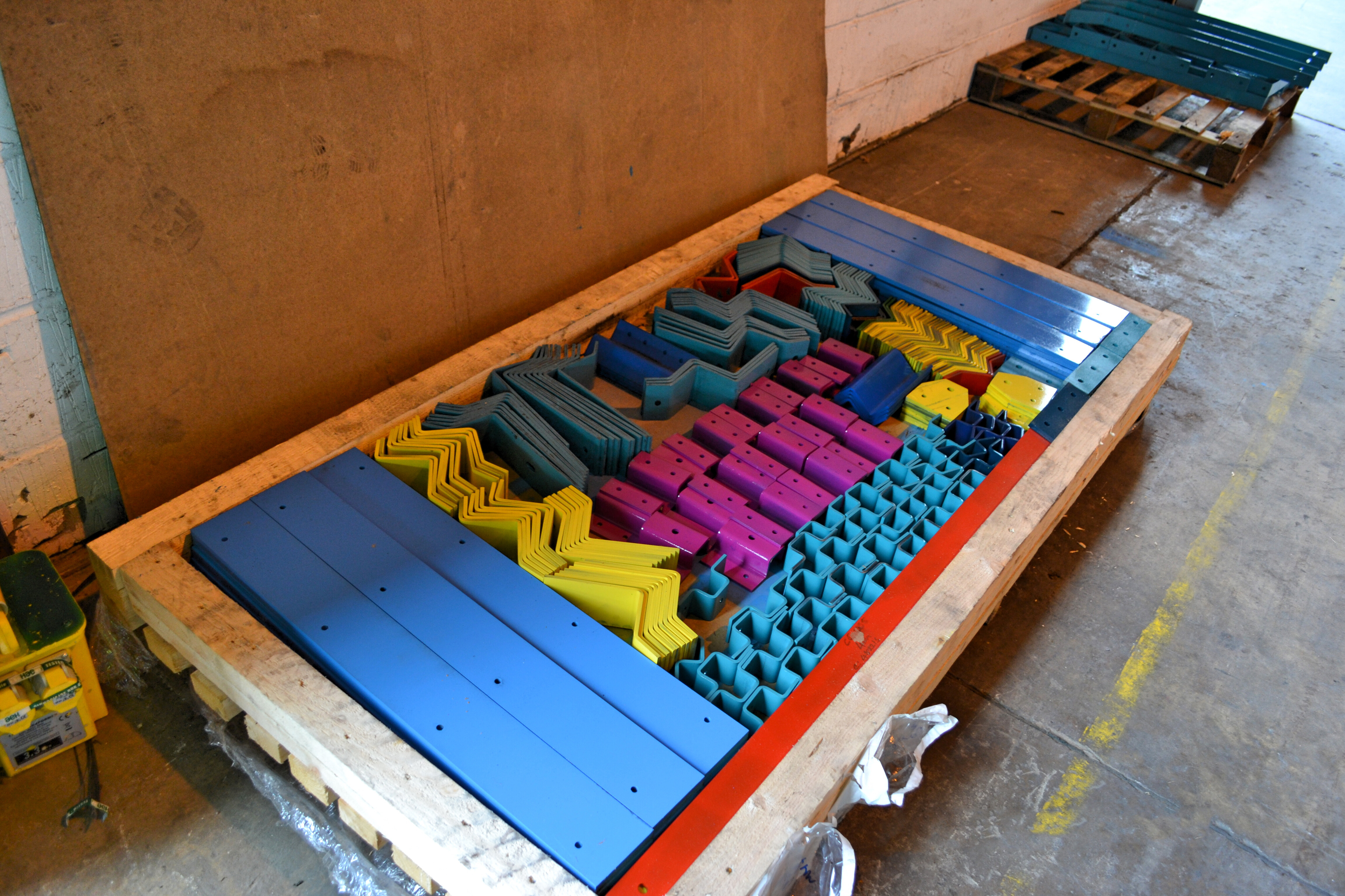 Colourful brackets used in factory-in-a-box type construction: Modern methods of construction offer a pathway to sustainable development.