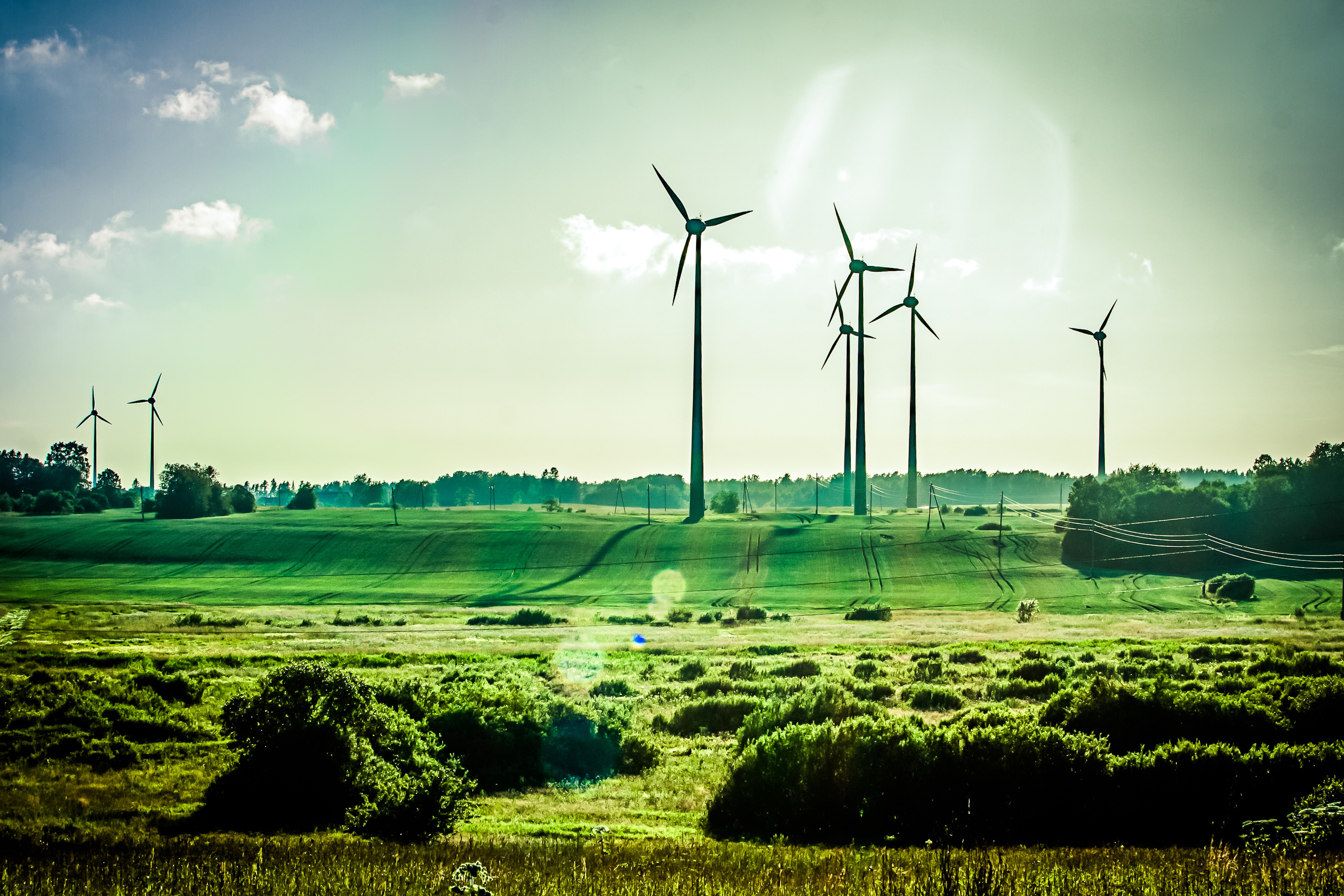 Wind turbines on a green field: Impact investing is growing rapidly