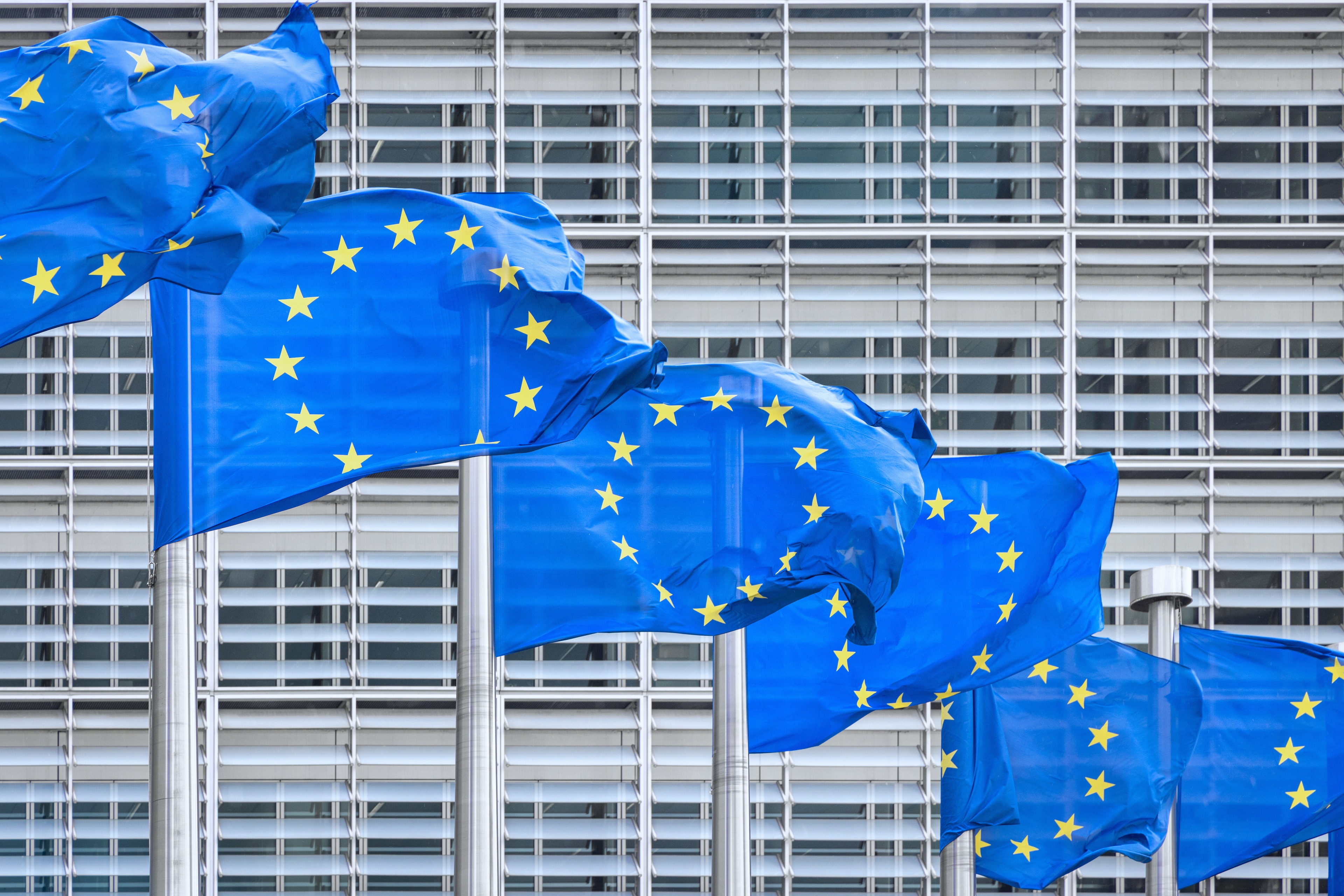 European Union flags outside European Commission building in Brussels, Belgium. Close up