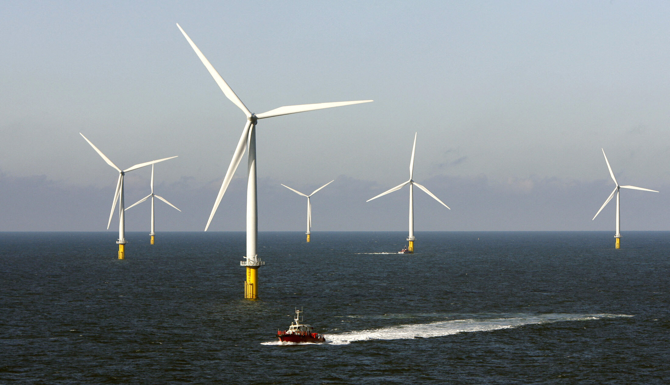 A crew boat passes through Horns Rev 2, the world's largest wind farm, 30 km (19 miles) off the west coast of Denmark near Esbjerg September 15, 2009: The ocean economy is a high-potential investment frontier