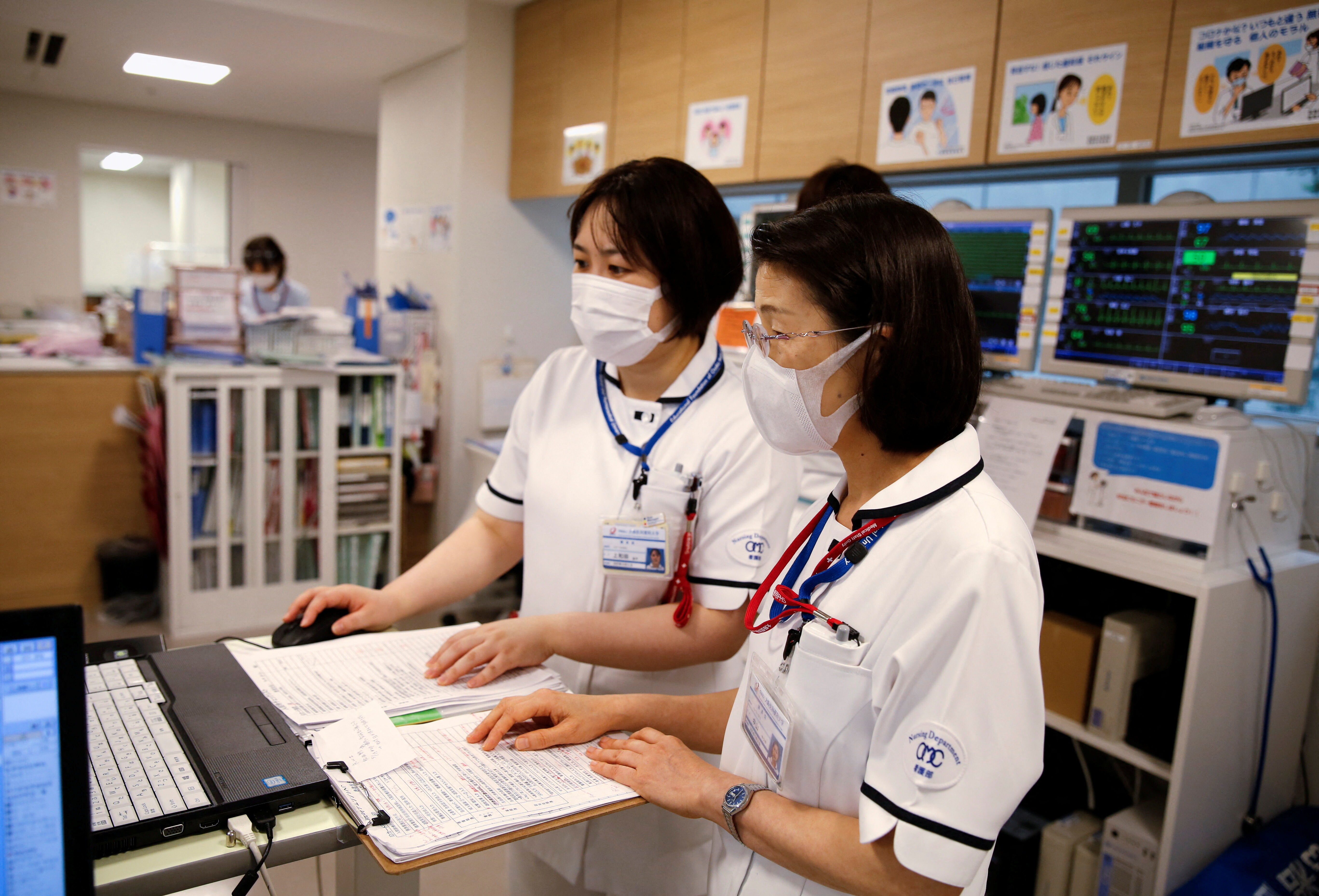 Satsuki Nakayama, director of the nursing department at Osaka Medical and Pharmaceutical University Hospital, works with her colleague in the operation wing of the hospital, amid the coronavirus disease (COVID-19) pandemic, in Takatsuki, Osaka prefecture, Japan May 17, 2021: Non-communicable diseases pose a huge burden worldwide, especially ageing populations like Japan