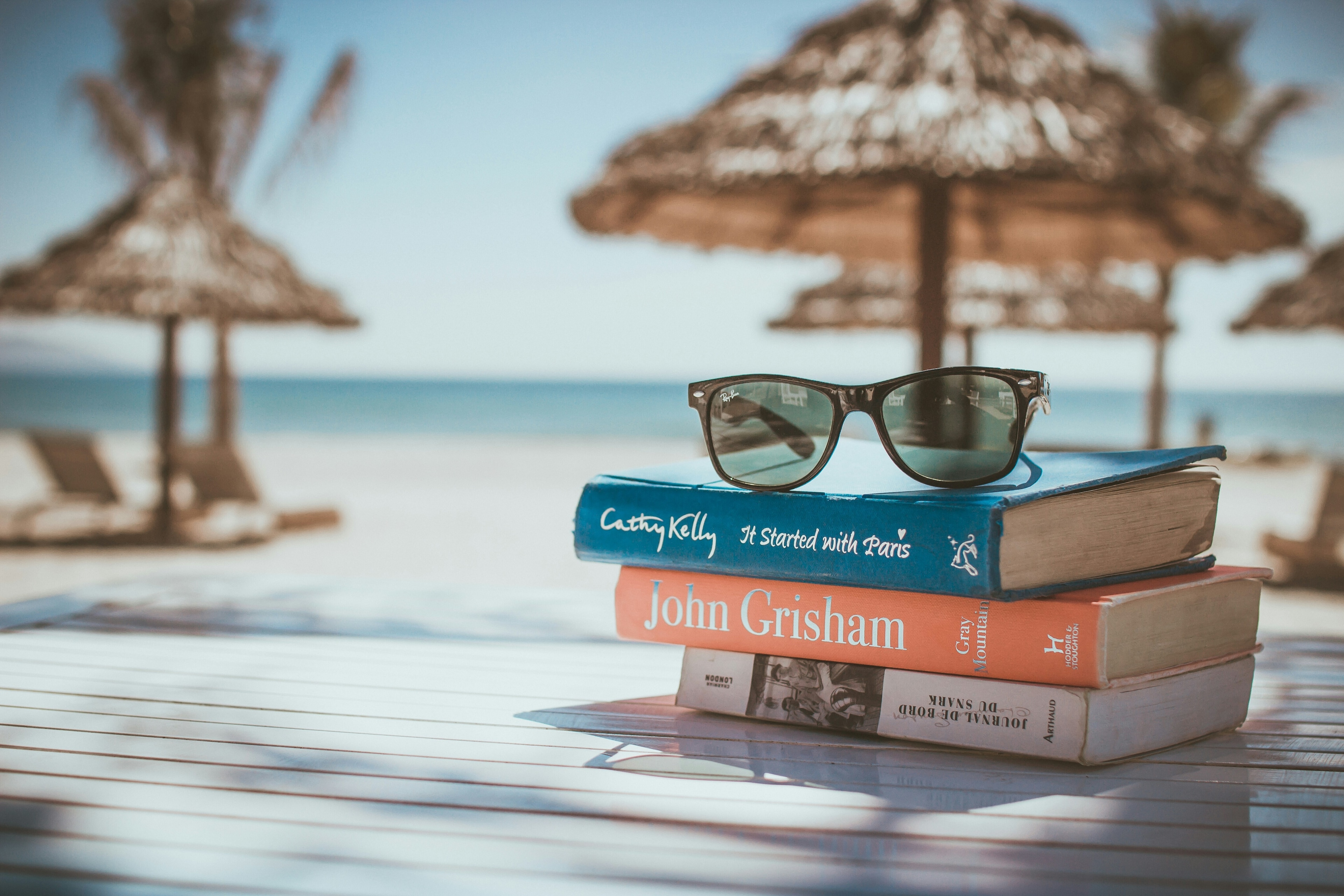 A stack of books at a holiday resort: Brands are increasingly offering embedded insurance at the point of check out