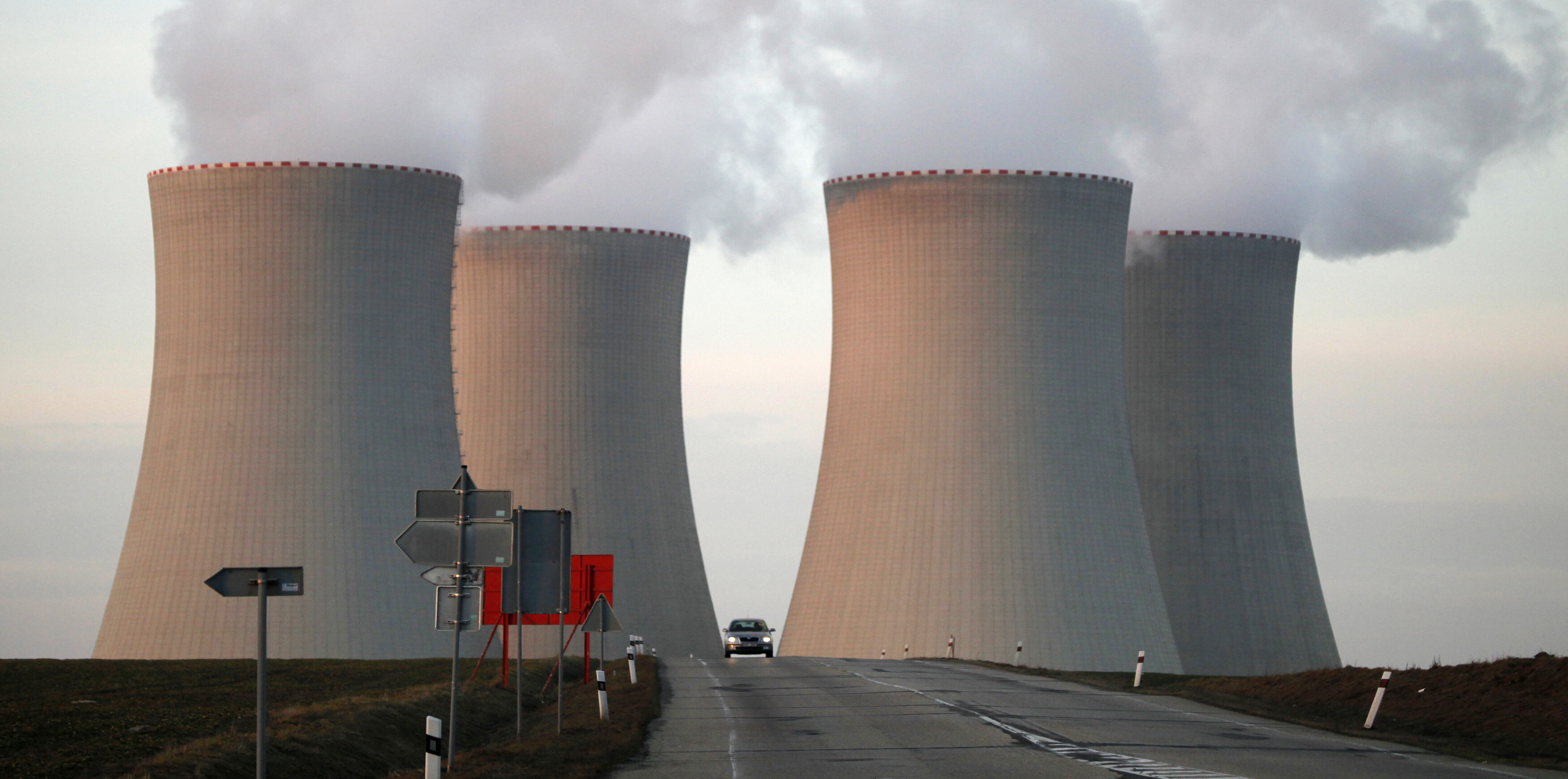 A car passes between cooling towers of the Temelin nuclear power plant near the South Bohemian city of Tyn nad Vltavou, 80 miles (130 kilometres) south of Prague March 14, 2011. The Czech Republic has no immediate plans to review its atomic expansion plans due to the nuclear crisis in Japan following an earthquake and tsunami, the Czech's nuclear safety office chief said on Monday: Nuclear energy is fast becoming a mainstream tool.