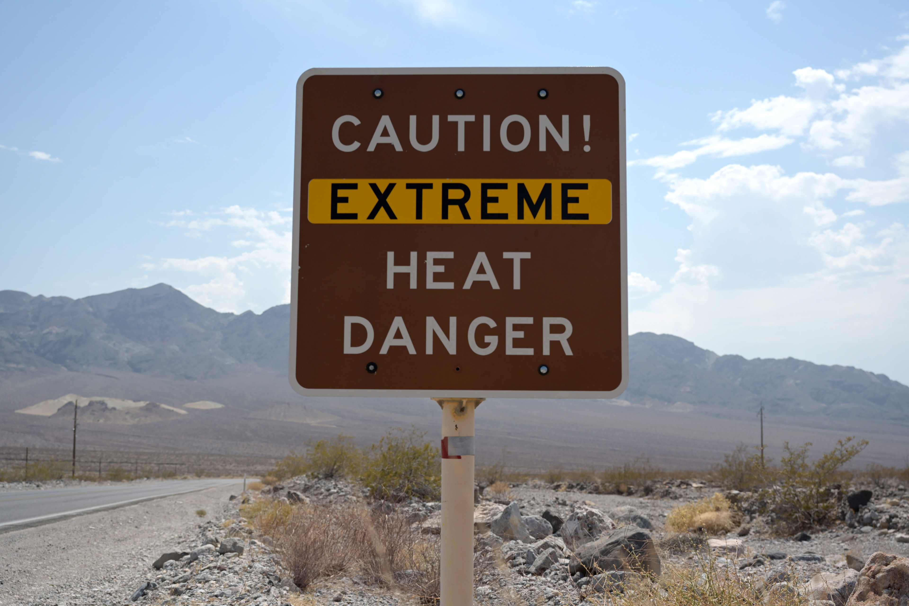 A sign warns of extreme heat in Death Valley, California, U.S.