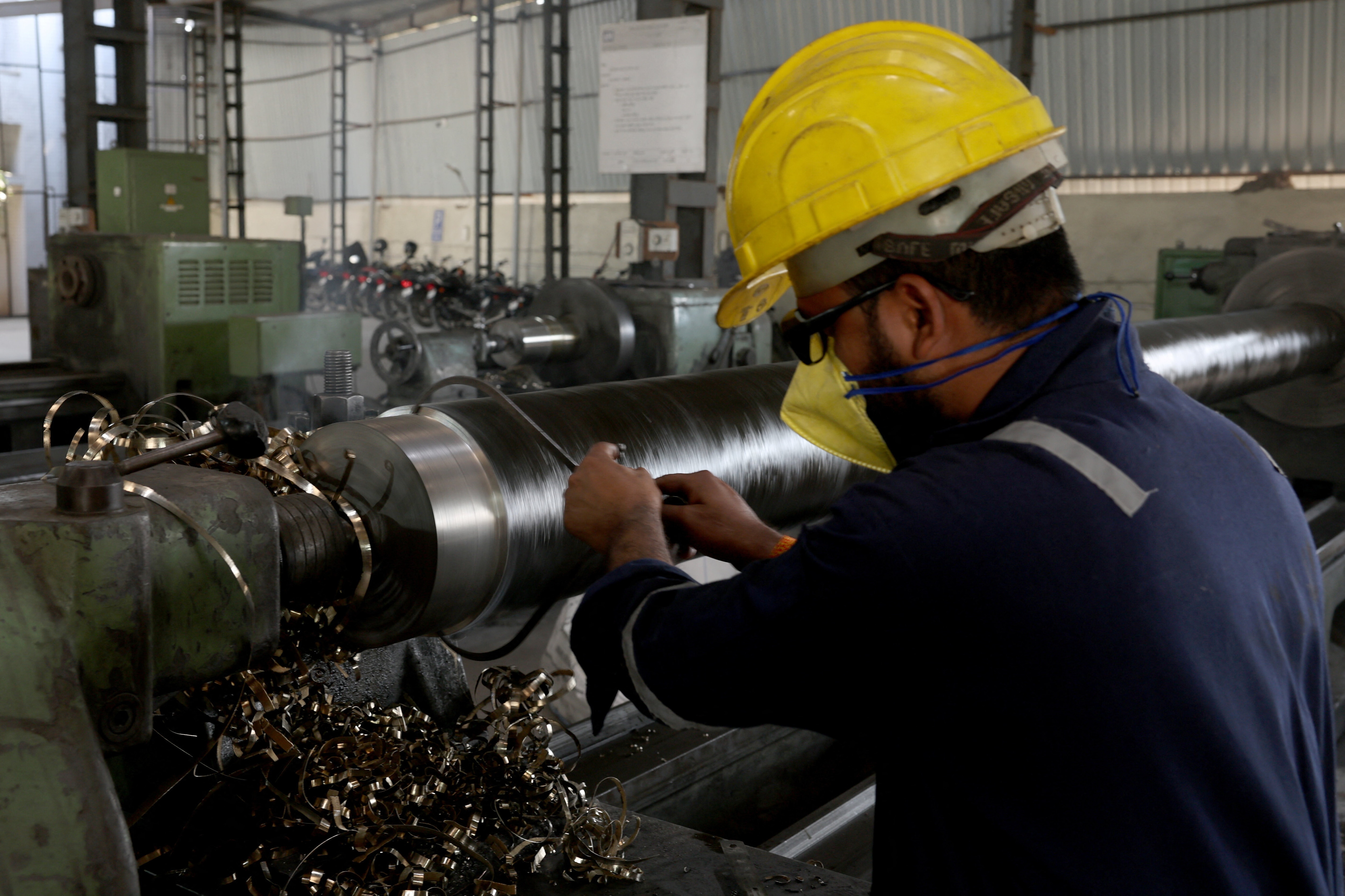 A worker checks the gauge of a steel bar inside a steel factory on the outskirts of Ahmedabad, India, January 28, 2026. REUTERS/Amit Dave