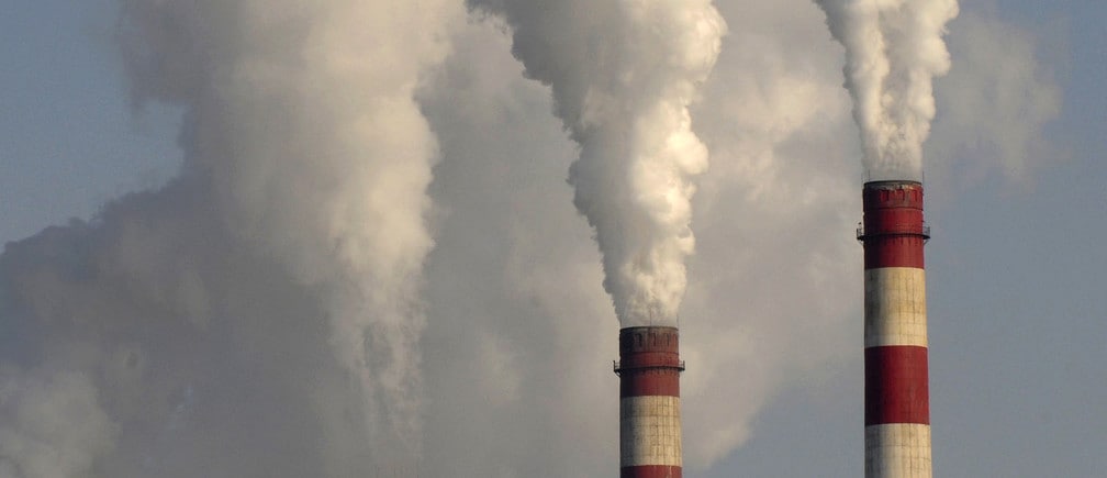 Smoke rises from chimneys of a power plant in Changzhi, Shanxi province November 17, 2009. China will reduce its carbon intensity -- the amount of carbon dioxide emitted for each unit of GDP -- 40 to 45 percent by 2020, compared with 2005 levels, the official Xinhua news agency reported. Picture taken November 17, 2009. REUTERS/Stringer (CHINA ENERGY ENVIRONMENT BUSINESS) CHINA OUT. NO COMMERCIAL OR EDITORIAL SALES IN CHINA - GM1E5C21A1F01