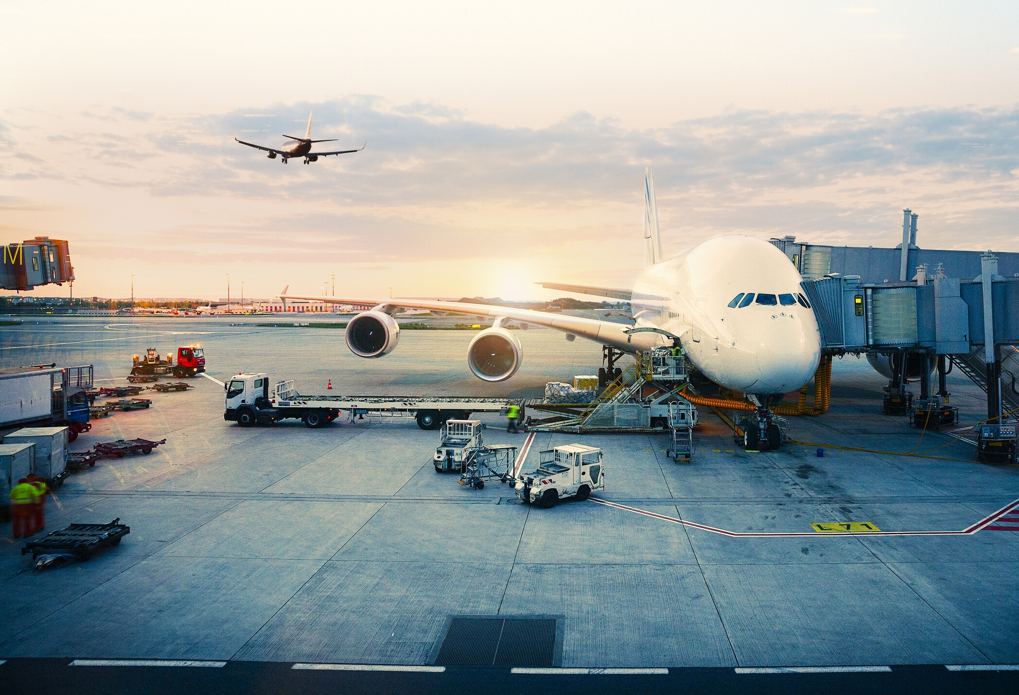 View of airplane at the airport at sunrise. Paris, France: Availability and cost of sustainable aviation fuel remain a challenge