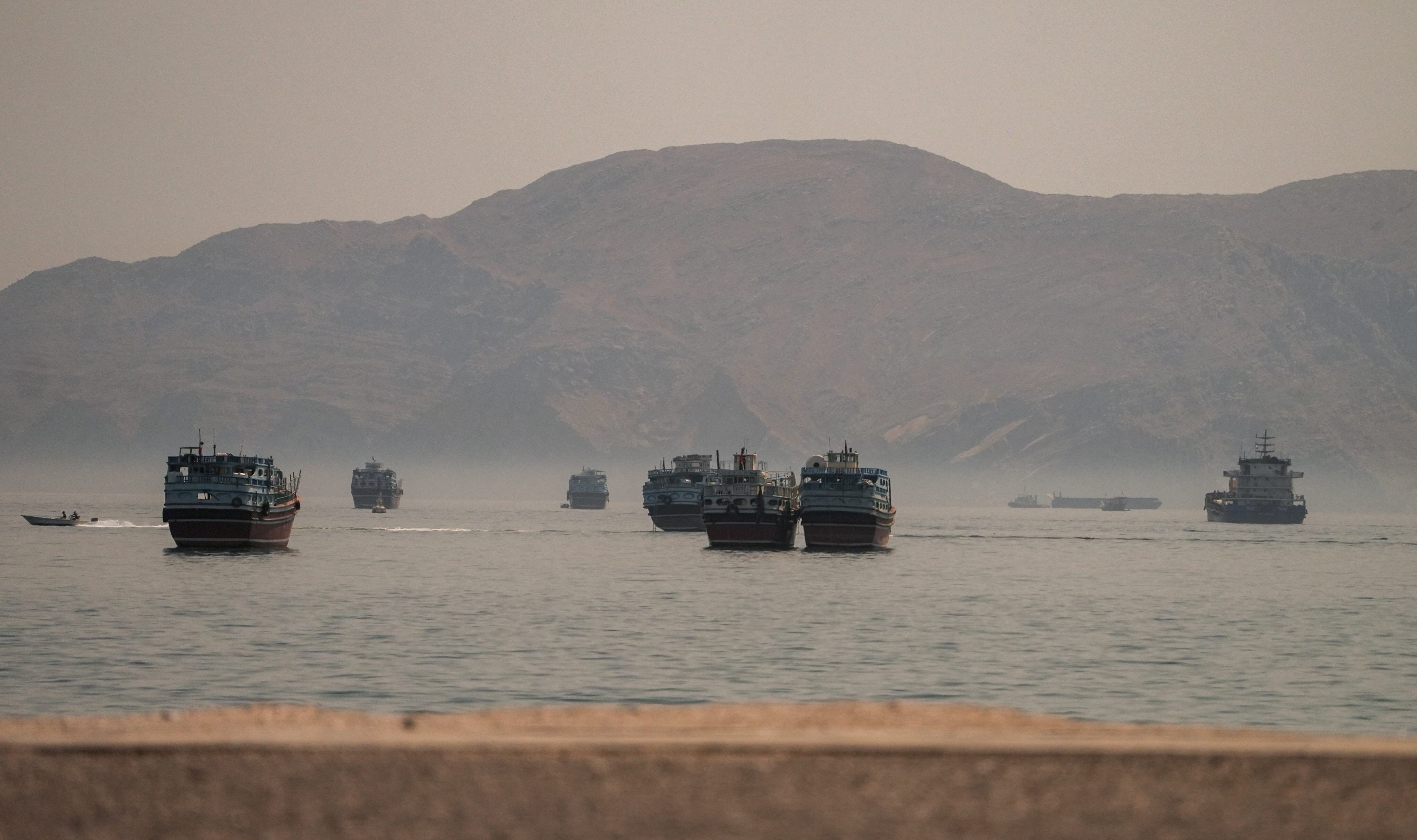Vessels are anchored in the Strait of Hormuz, as seen from Musandam, Oman, June 19, 2026. REUTERS/Stringer