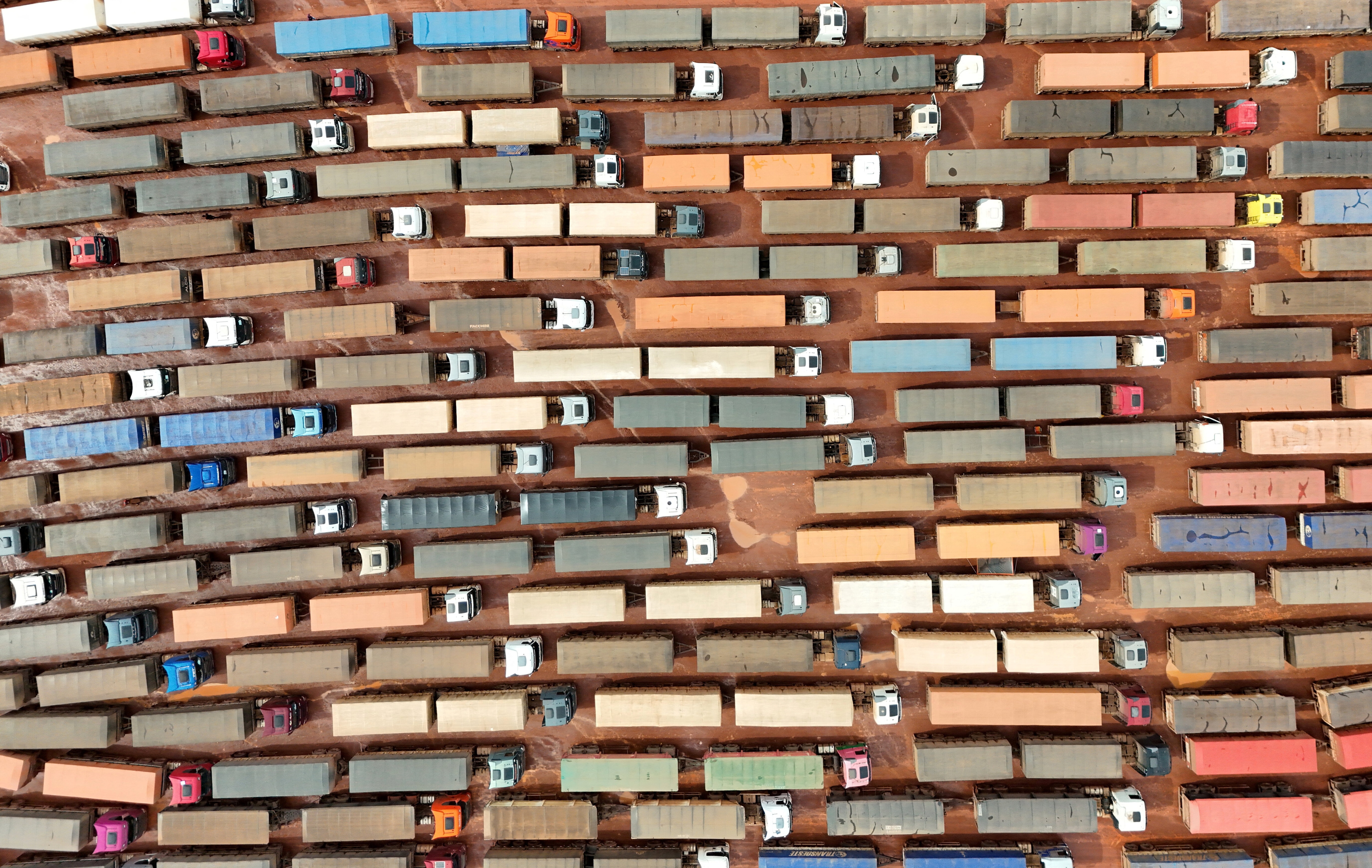 FILE PHOTO: A drone view shows trucks loaded with soybeans waiting to unload at the port of Miritituba as heavy grain traffic in the region has led to long lines during Brazil's harvest shipping season, in Miritituba, Brazil, February 25, 2026. REUTERS/Adriano Machado       TPX IMAGES OF THE DAY/File Photo